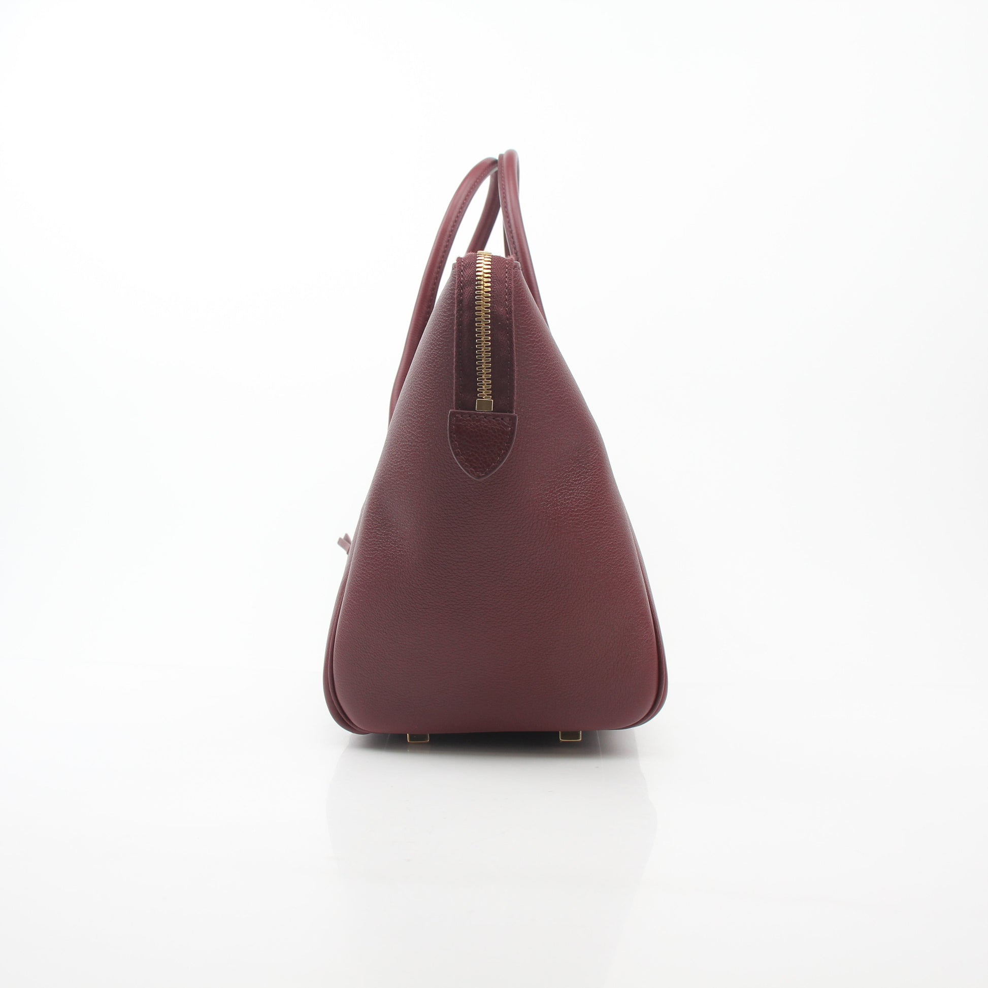 Gold & Beyond Celine Burgundy shoulder luggage tote handbag with top handles and spacious interior.