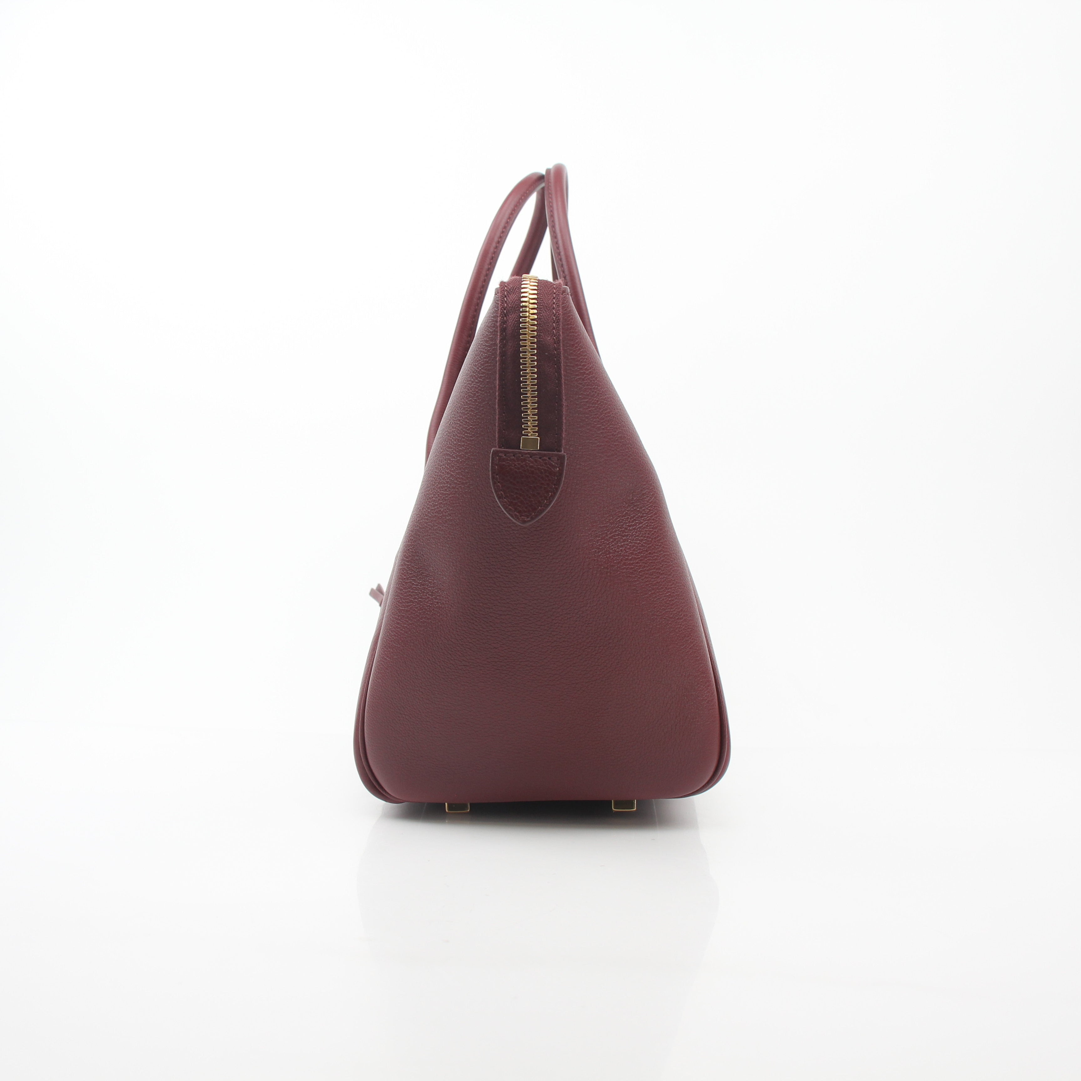 Gold & Beyond Celine Burgundy shoulder luggage tote handbag with top handles and spacious interior.