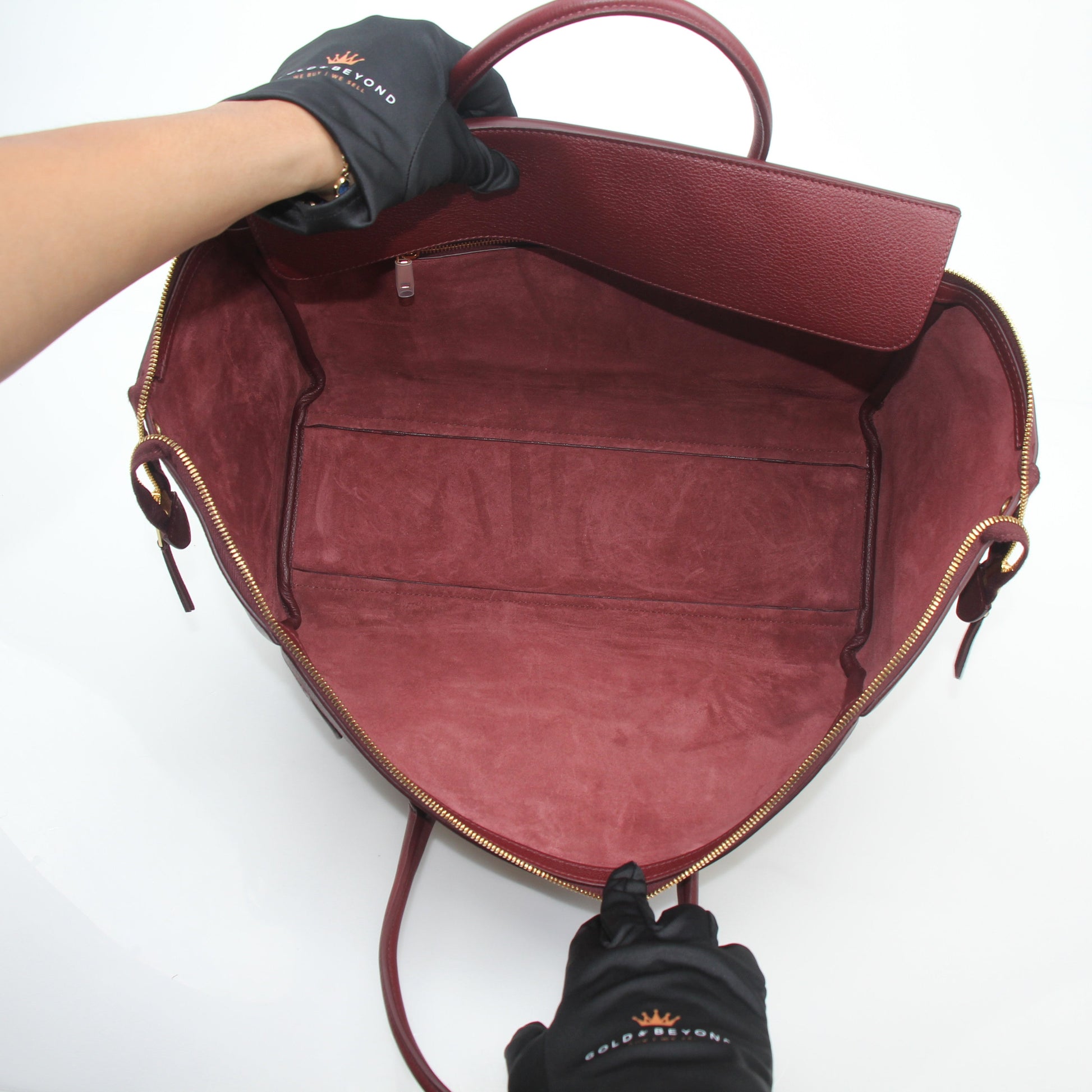 Gold & Beyond Celine Burgundy shoulder luggage tote handbag with structured design and top handles on a plain background.