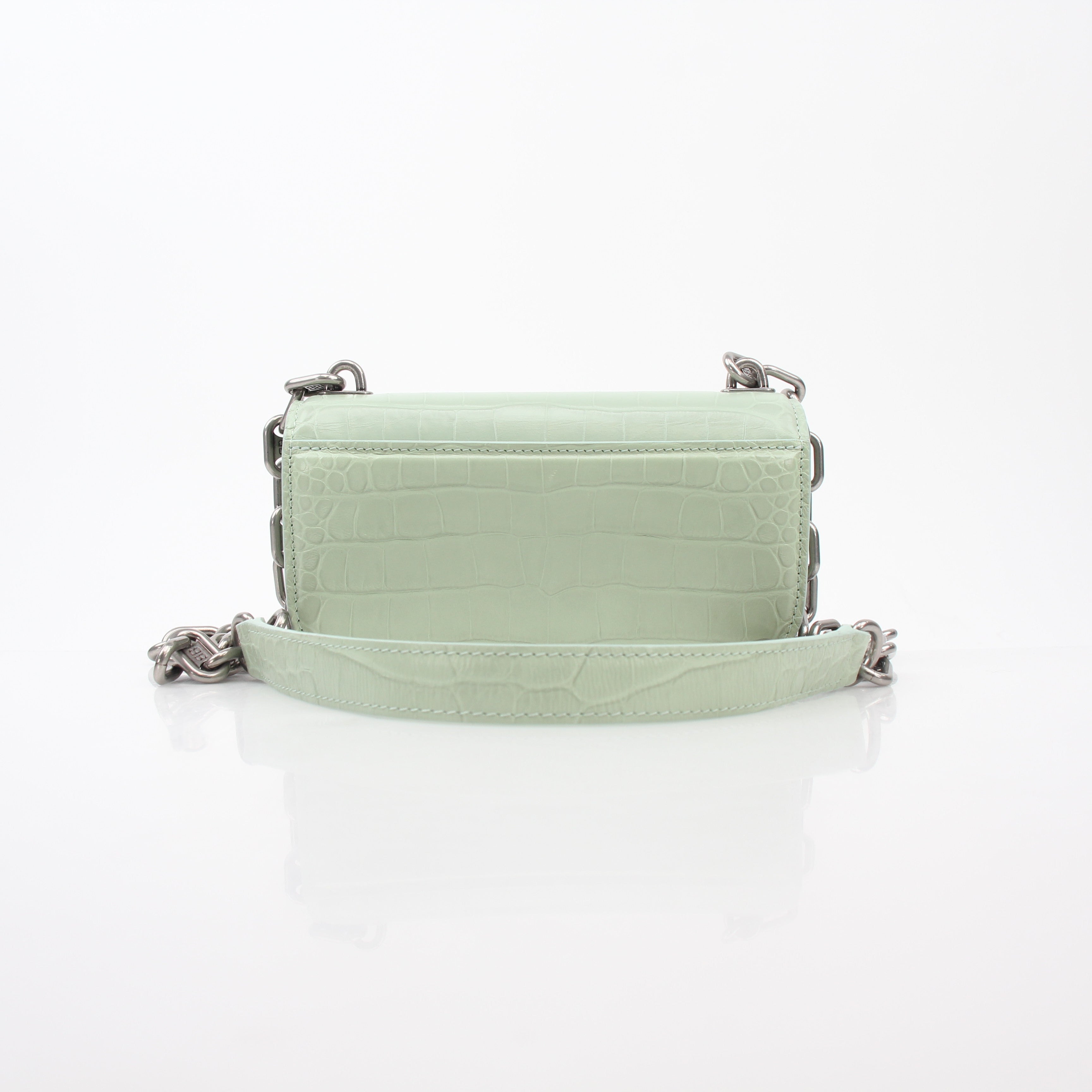 Light green Balenciaga Gossip XS chain handbag with gold hardware, featuring a structured leather design and adjustable strap.