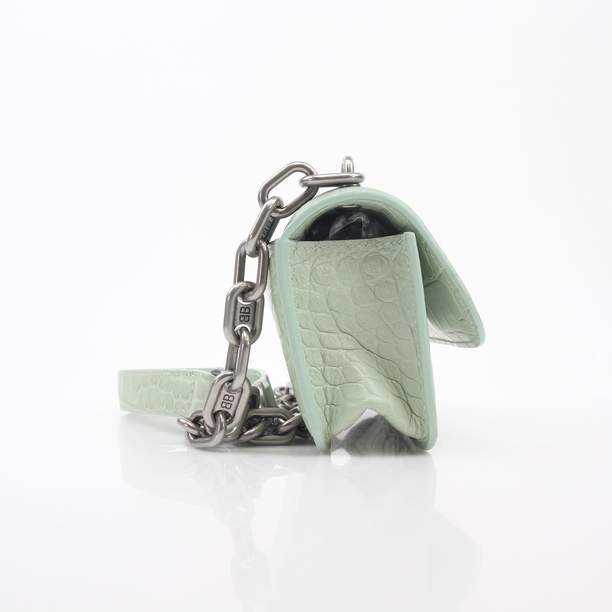Light green Balenciaga Gossip XS chain handbag with gold hardware, featuring a structured design and top handle.