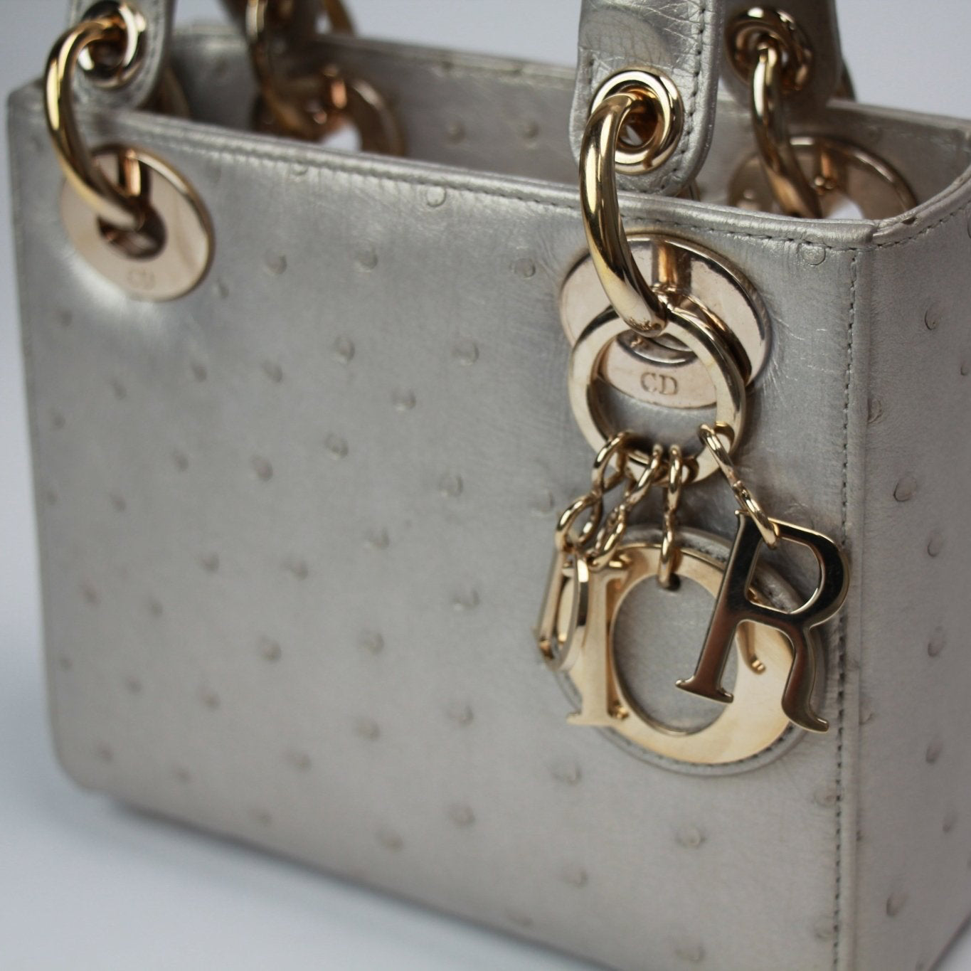 Gold & Beyond Dior Lady Dior Mini Bag handbag with signature quilting and top handle, stylish and compact accessory.