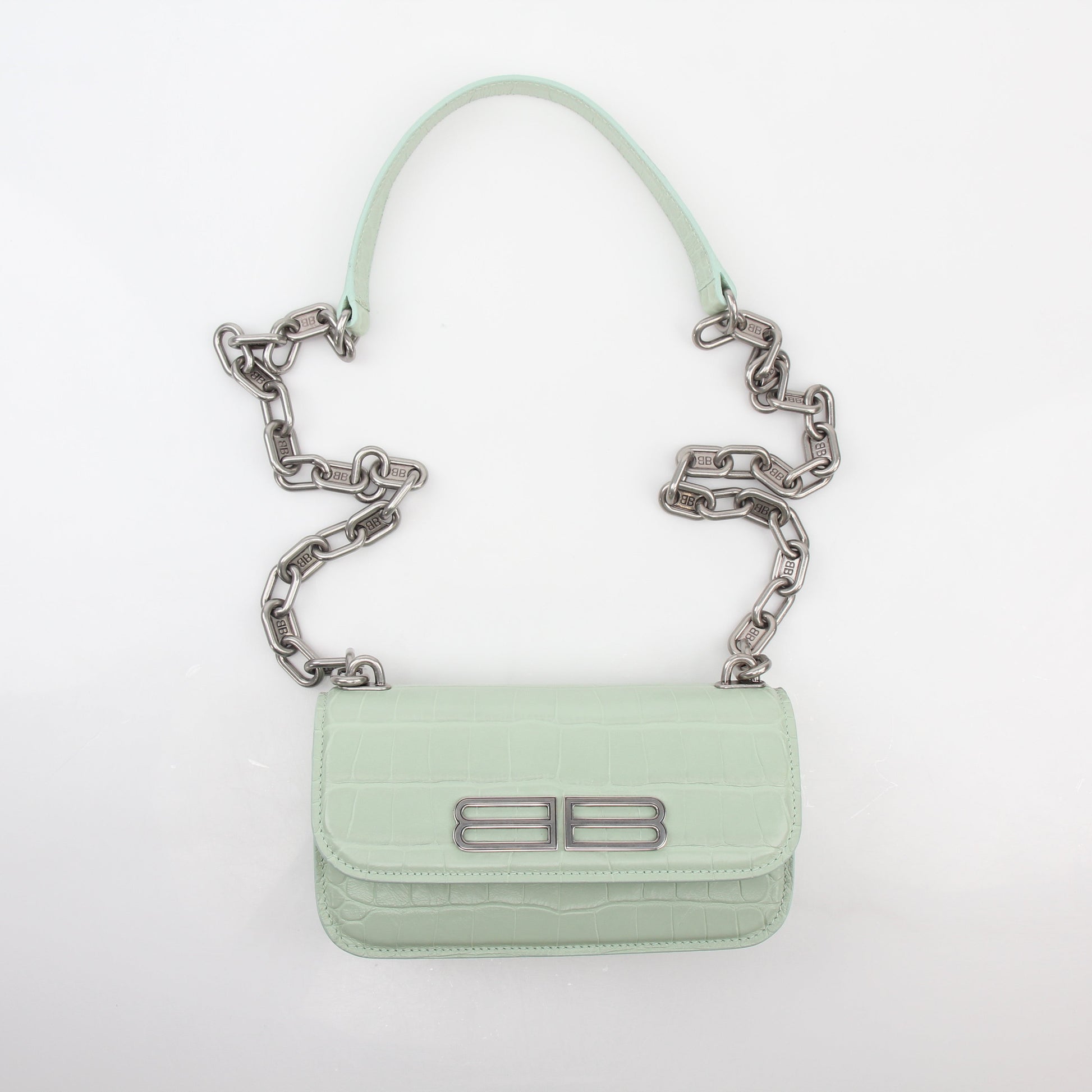 Light green Balenciaga Gossip XS chain handbag with gold hardware, featuring a structured silhouette and top handle.