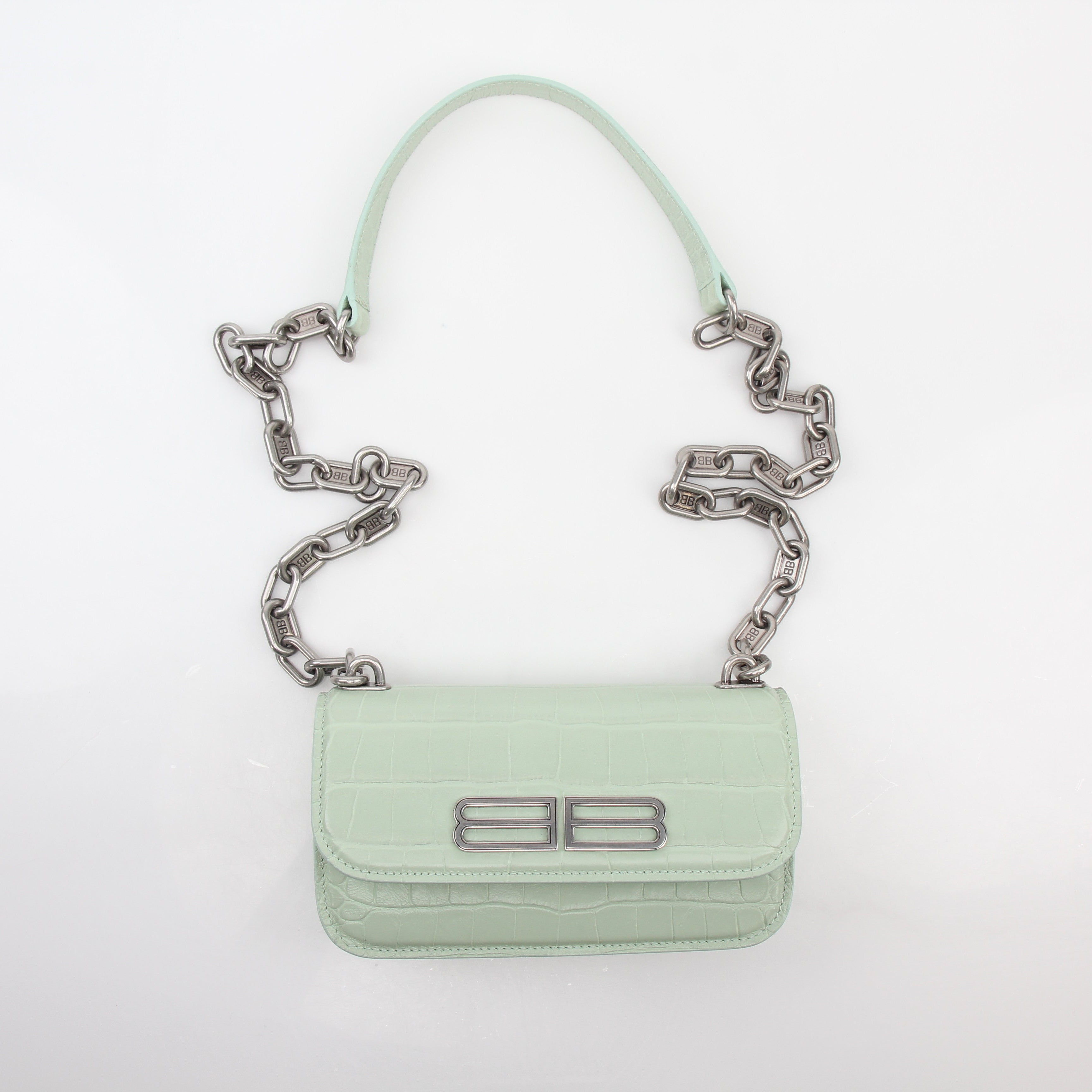 Light green Balenciaga Gossip XS chain handbag with gold hardware, featuring a structured silhouette and top handle.