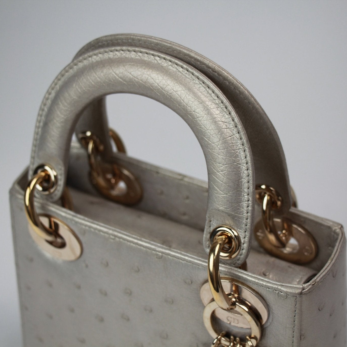 Gold & Beyond Dior Lady Dior Mini Handbag with quilted leather and top handles, featuring gold-tone hardware.