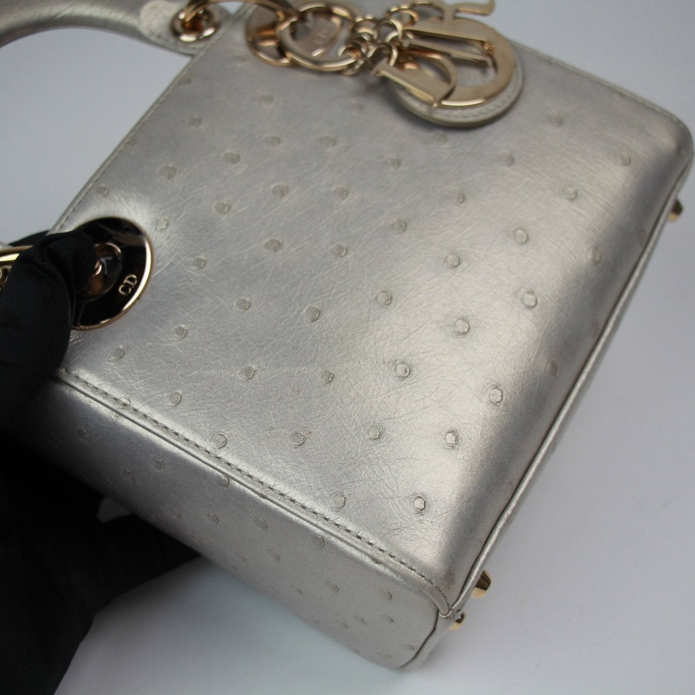Gold & Beyond Dior Lady Dior Mini Bag handbag with signature quilted pattern and top handle, detailed view of elegant design.