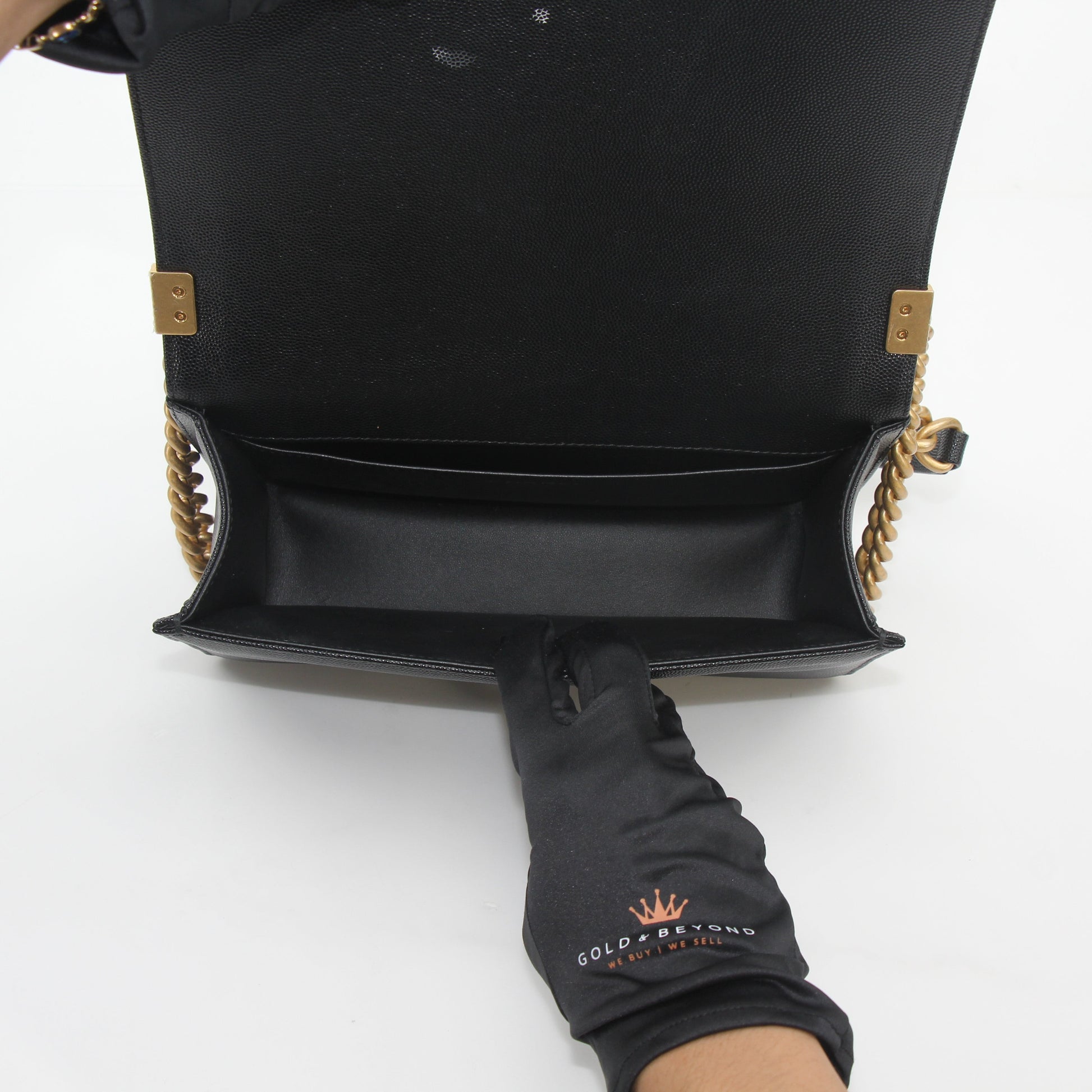 Black Chanel Caviar Boy Flap Shoulder Bag with gold hardware, featuring quilted leather and a chain strap, by Gold & Beyond.