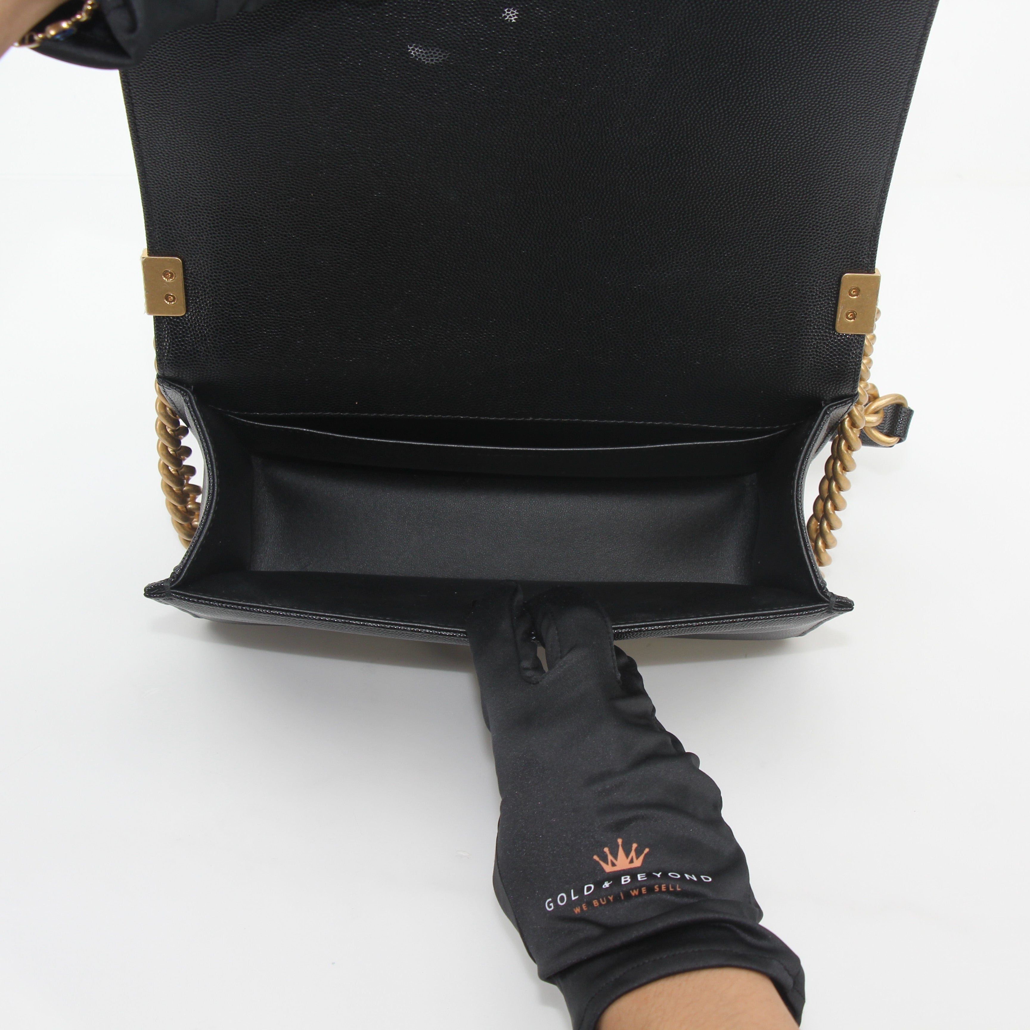 Black Chanel Caviar Boy Flap Shoulder Bag with gold hardware, featuring quilted leather and a chain strap, by Gold & Beyond.