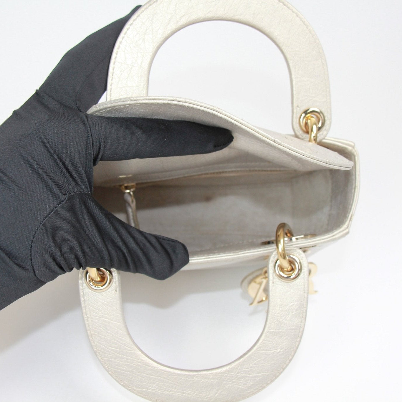 Gold & Beyond Dior Lady Dior Mini Handbag with signature quilting and top handle, showcasing elegant design and premium craftsmanship.