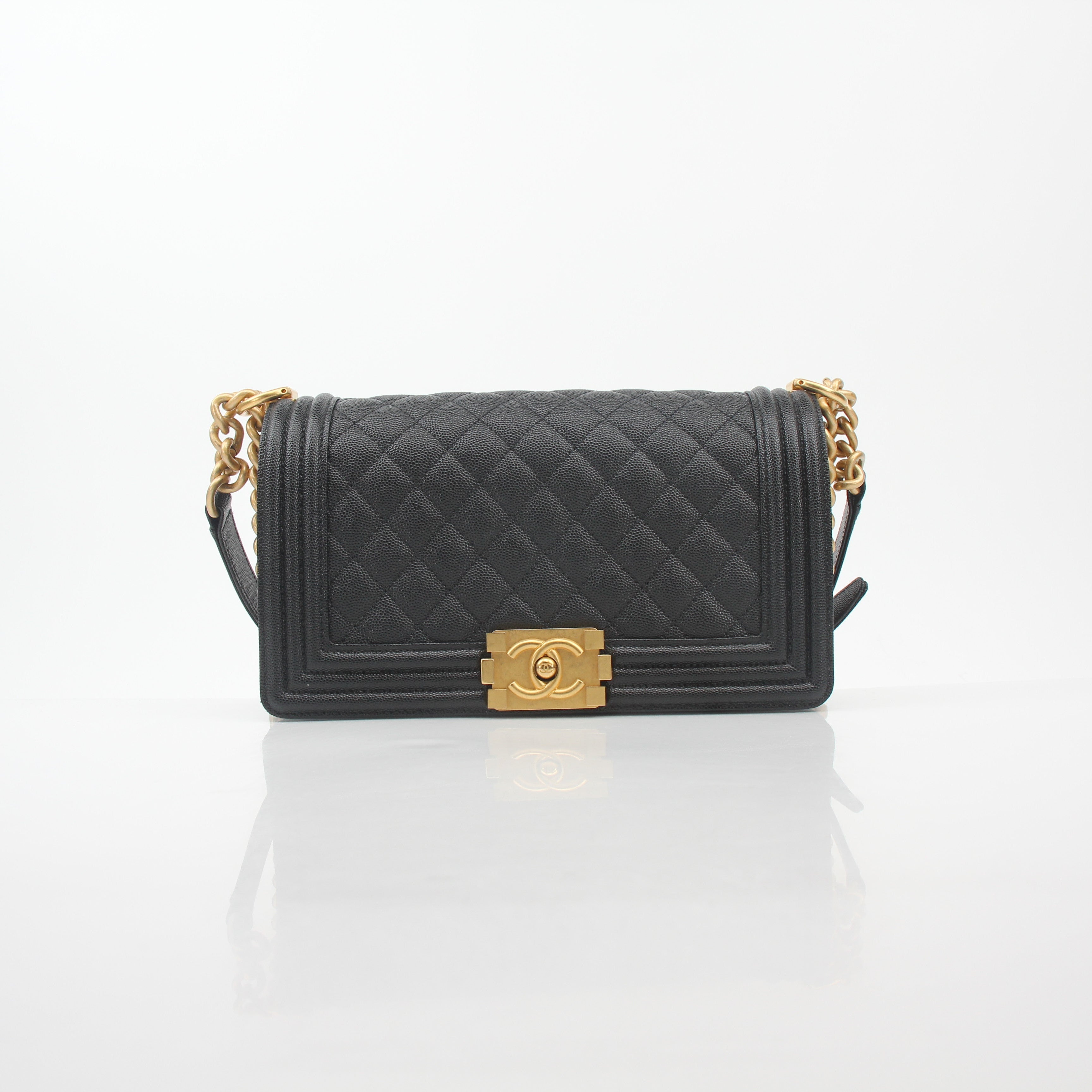 Black Chanel Caviar Boy Flap Shoulder Bag with gold hardware, featuring quilted leather and a chain strap.