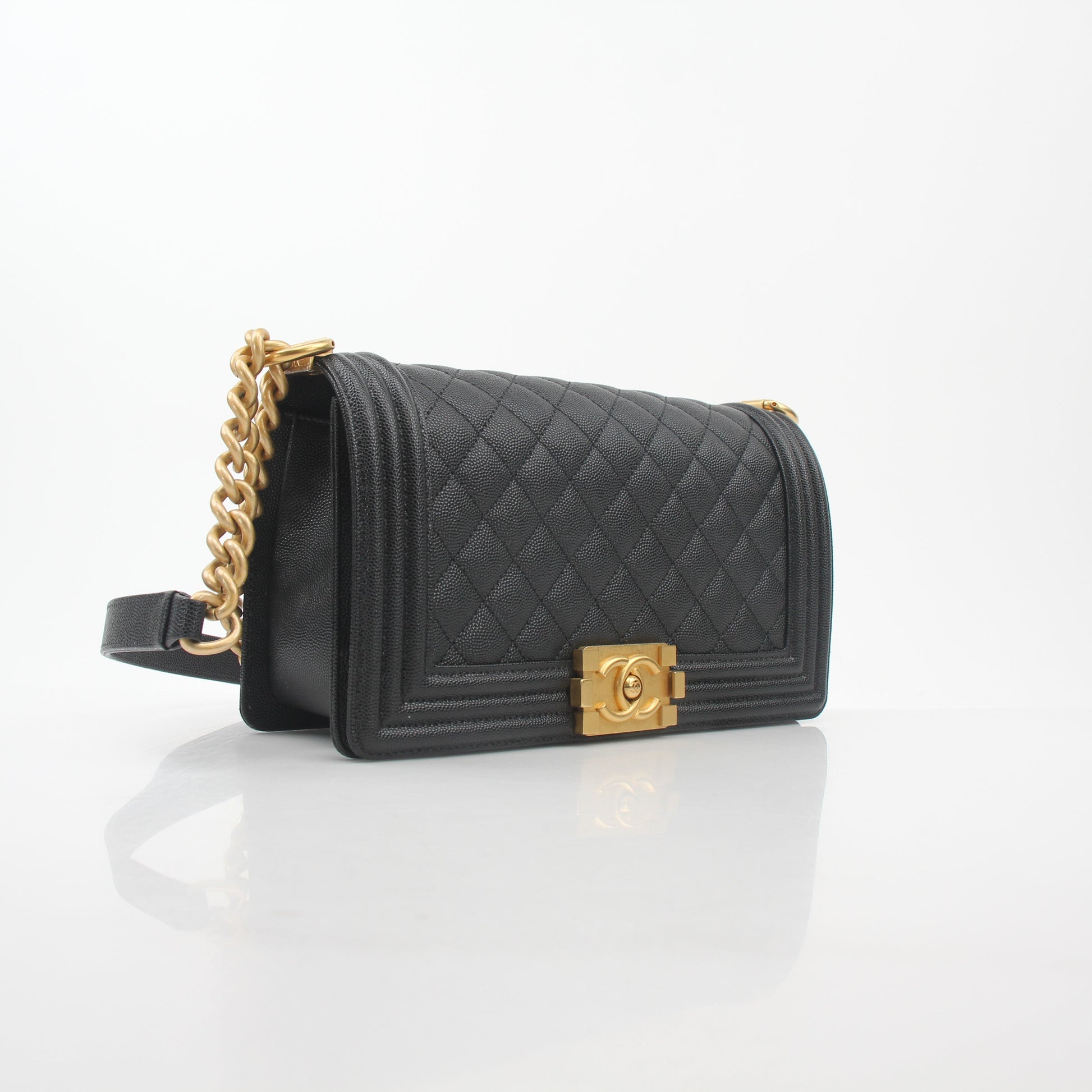 Chanel Black Caviar Boy Flap Shoulder Bag with gold hardware, featuring quilted leather and a classic shoulder strap.