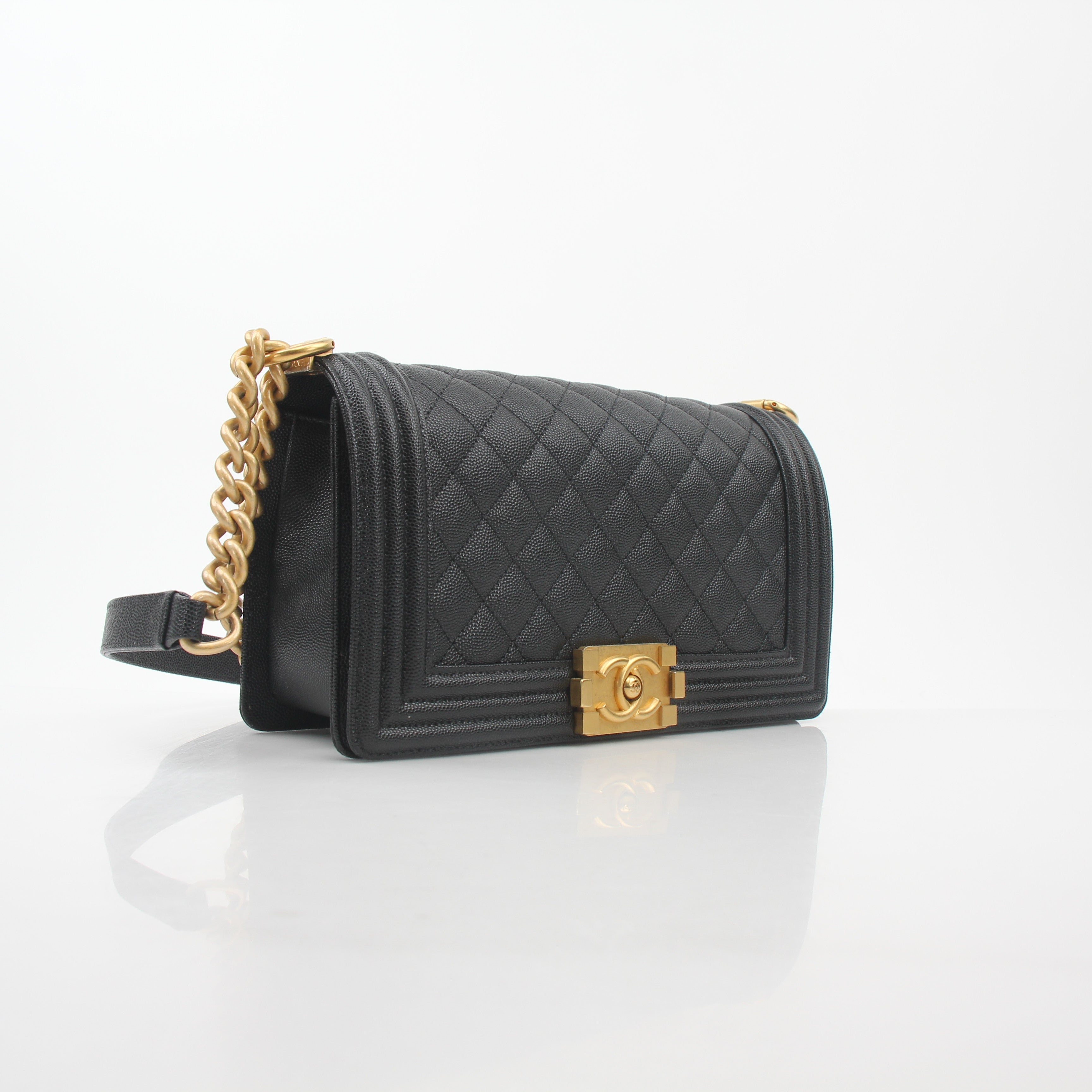 Chanel Black Caviar Boy Flap Shoulder Bag with gold hardware, featuring quilted leather and a classic shoulder strap.