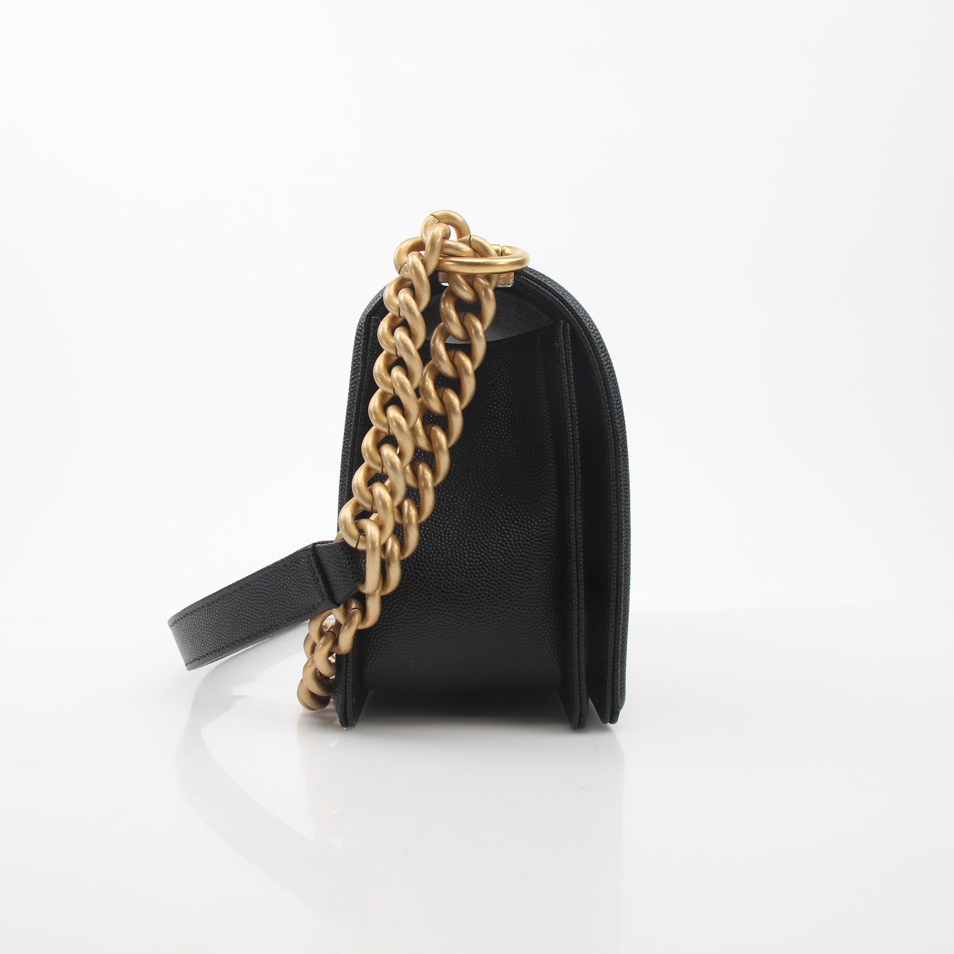 Chanel Black Caviar Boy Flap Shoulder Bag with gold hardware, featuring quilted leather and a signature flap design.