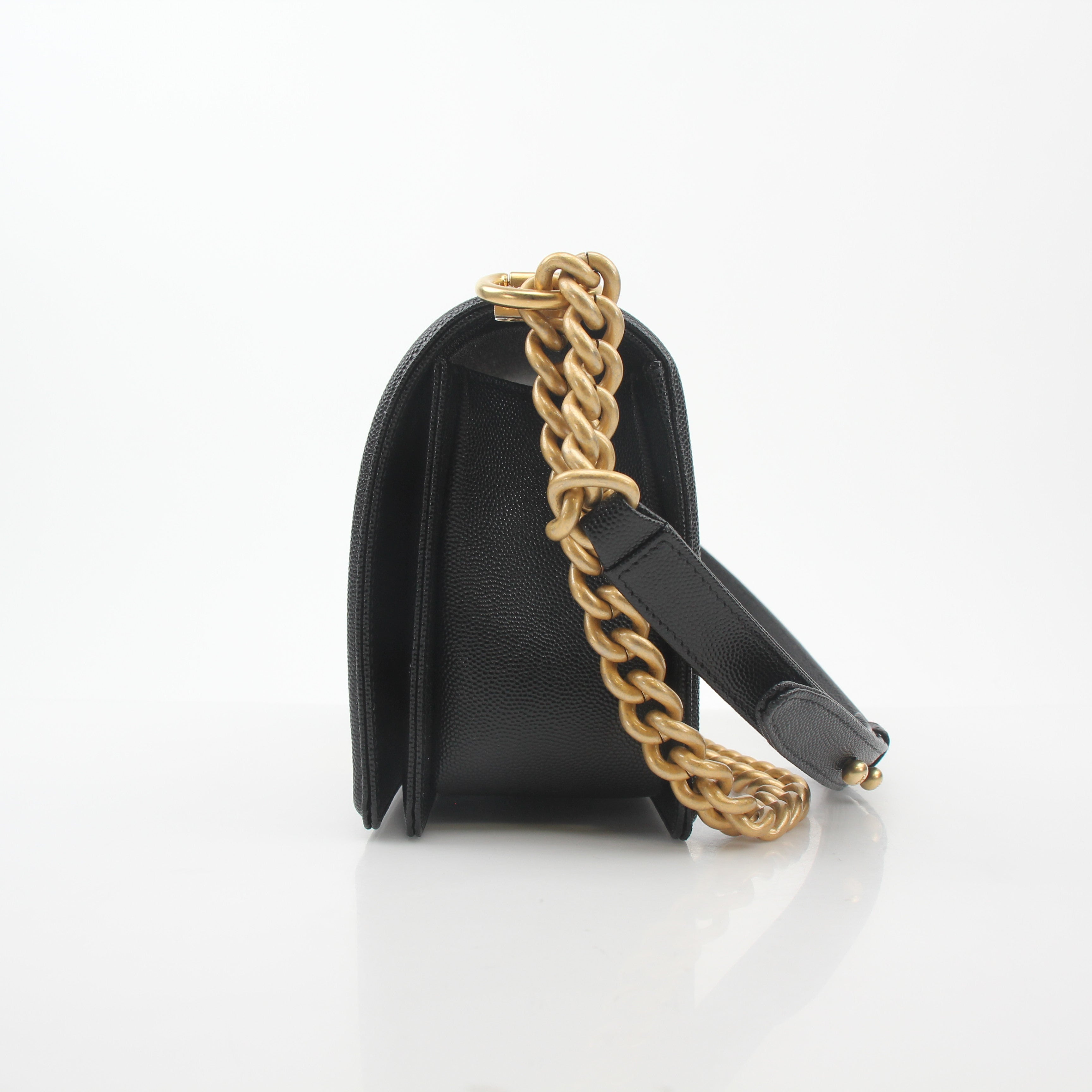 Chanel Black Caviar Boy Flap Shoulder Bag with gold hardware, featuring textured leather and a classic flap design.