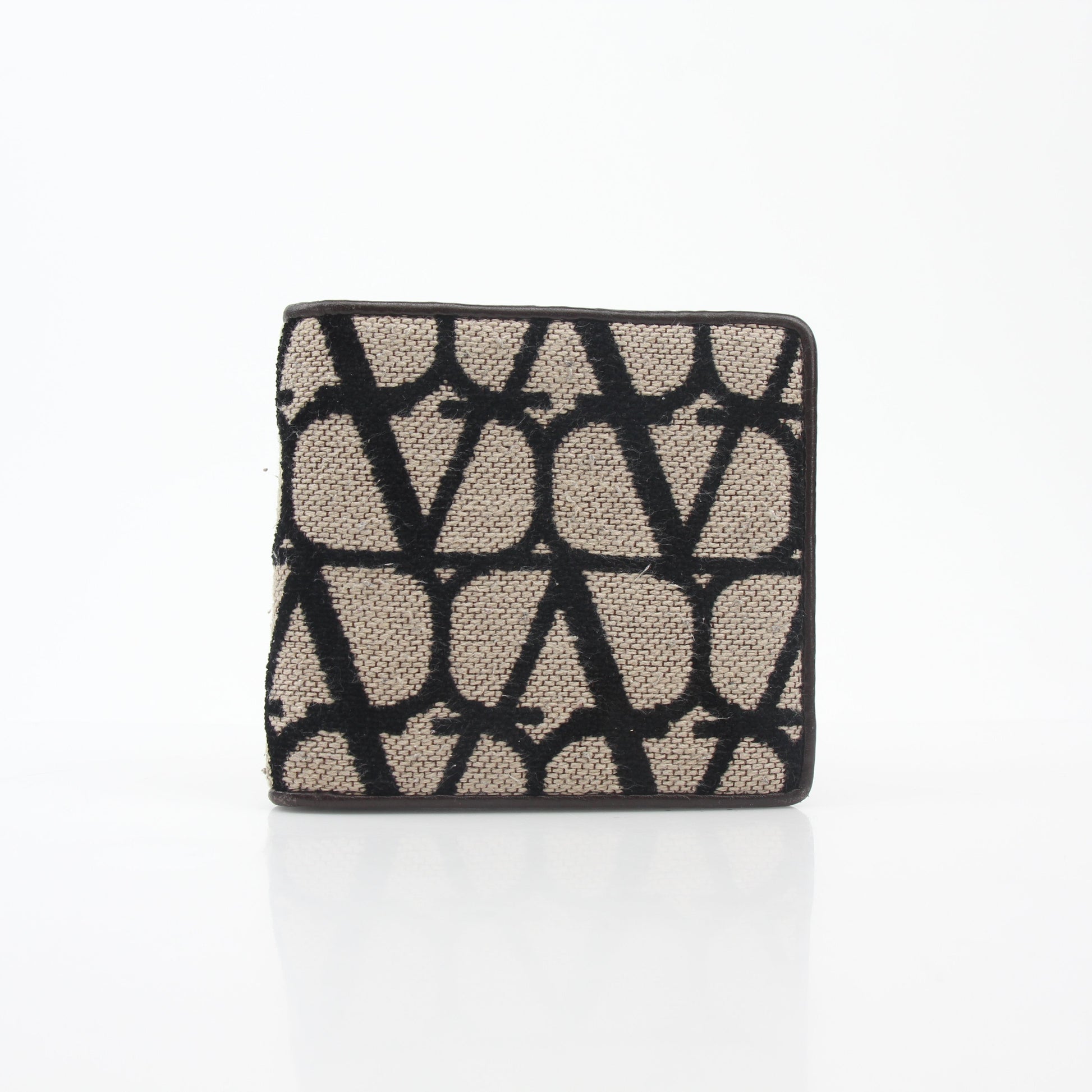 Valentino Garavani Toile Iconographe bifold wallet in natural and black leather with gold accents, showcasing detailed pattern and craftsmanship.