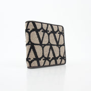 Valentino Garavani Toile Iconographe bifold wallet in natural and black leather with signature print and gold accents.
