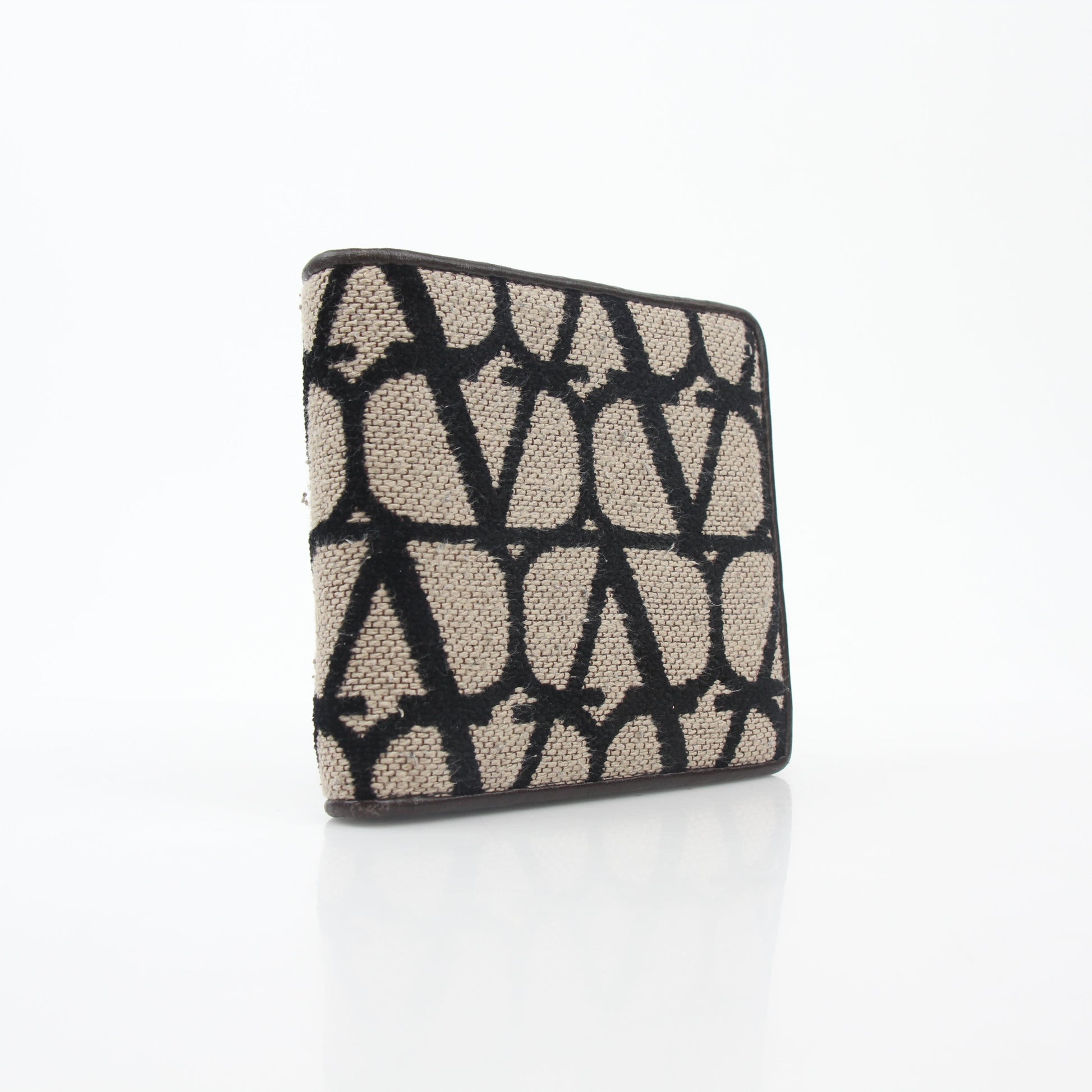 Valentino Garavani Toile Iconographe bifold wallet in natural and black leather with signature print and gold accents.