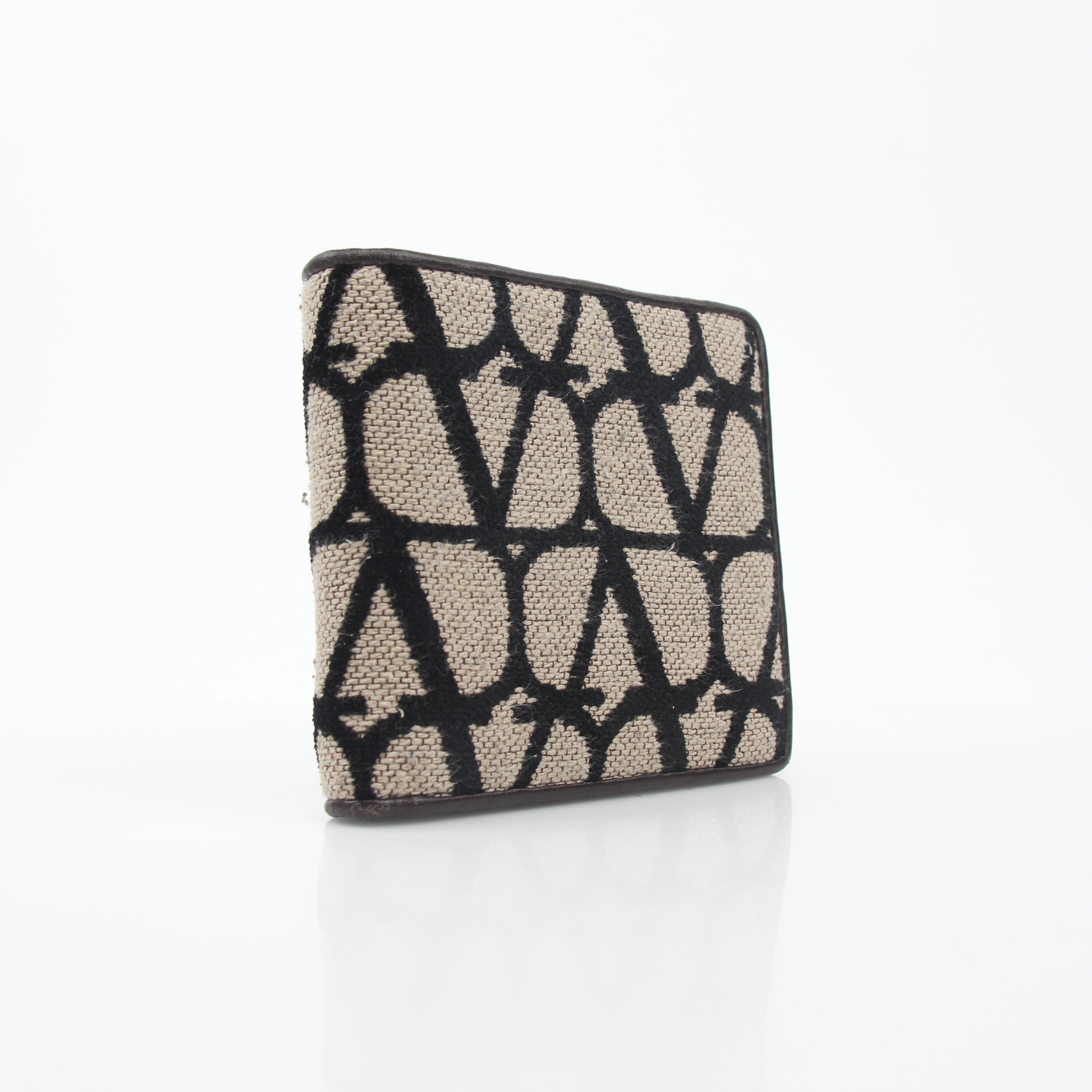 Valentino Garavani Toile Iconographe bifold wallet in natural and black leather with signature print and gold accents.
