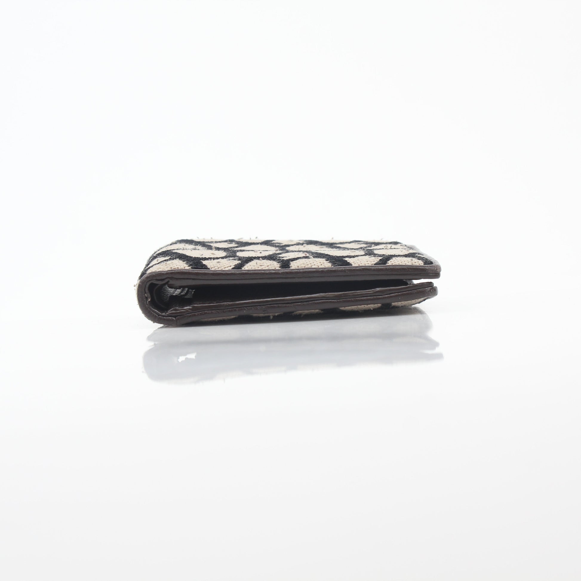 Valentino Garavani Toile Iconographe bifold wallet in natural and black leather with designer logo pattern.