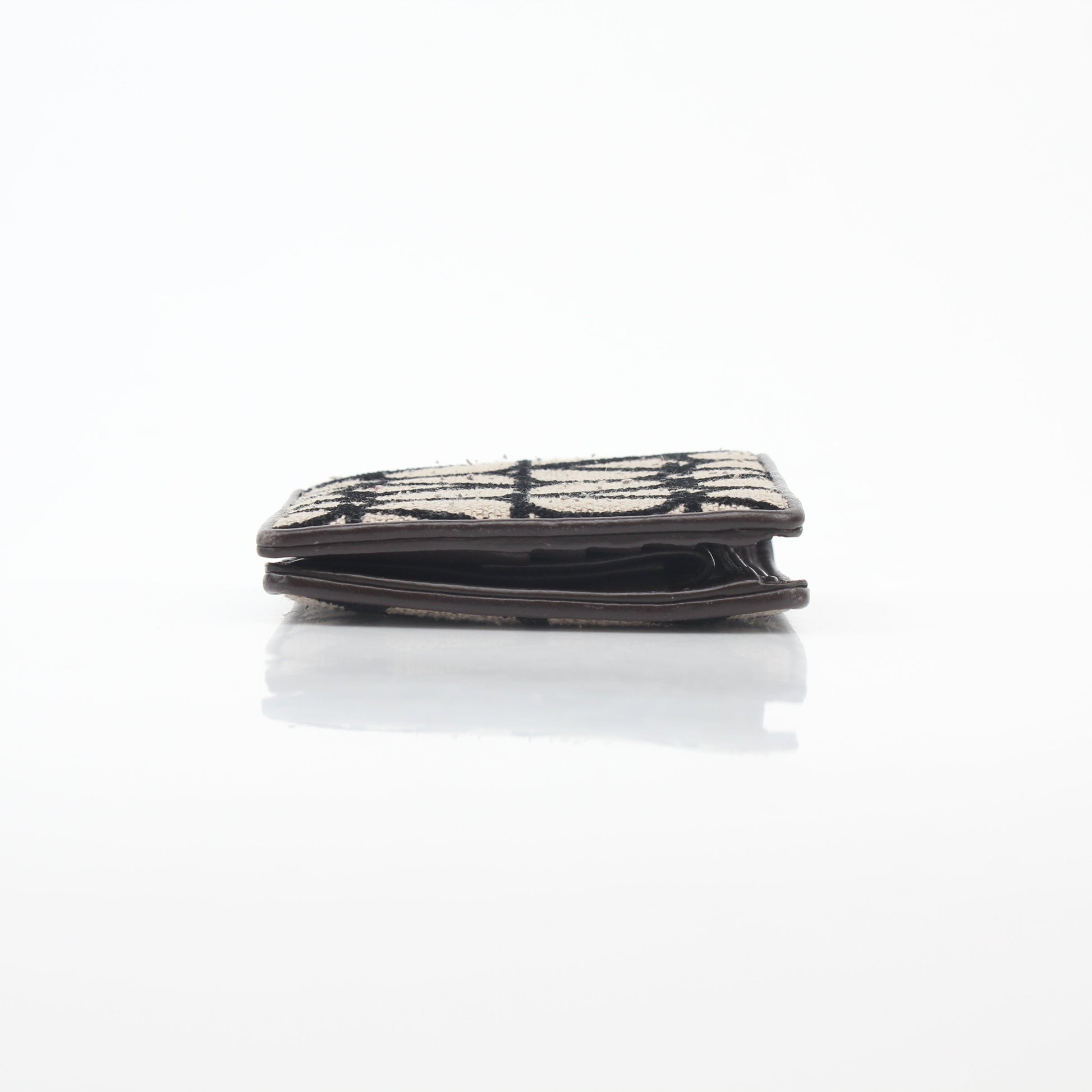 Valentino Garavani Toile Iconographe bifold wallet in natural and black leather, featuring signature design and branding details.
