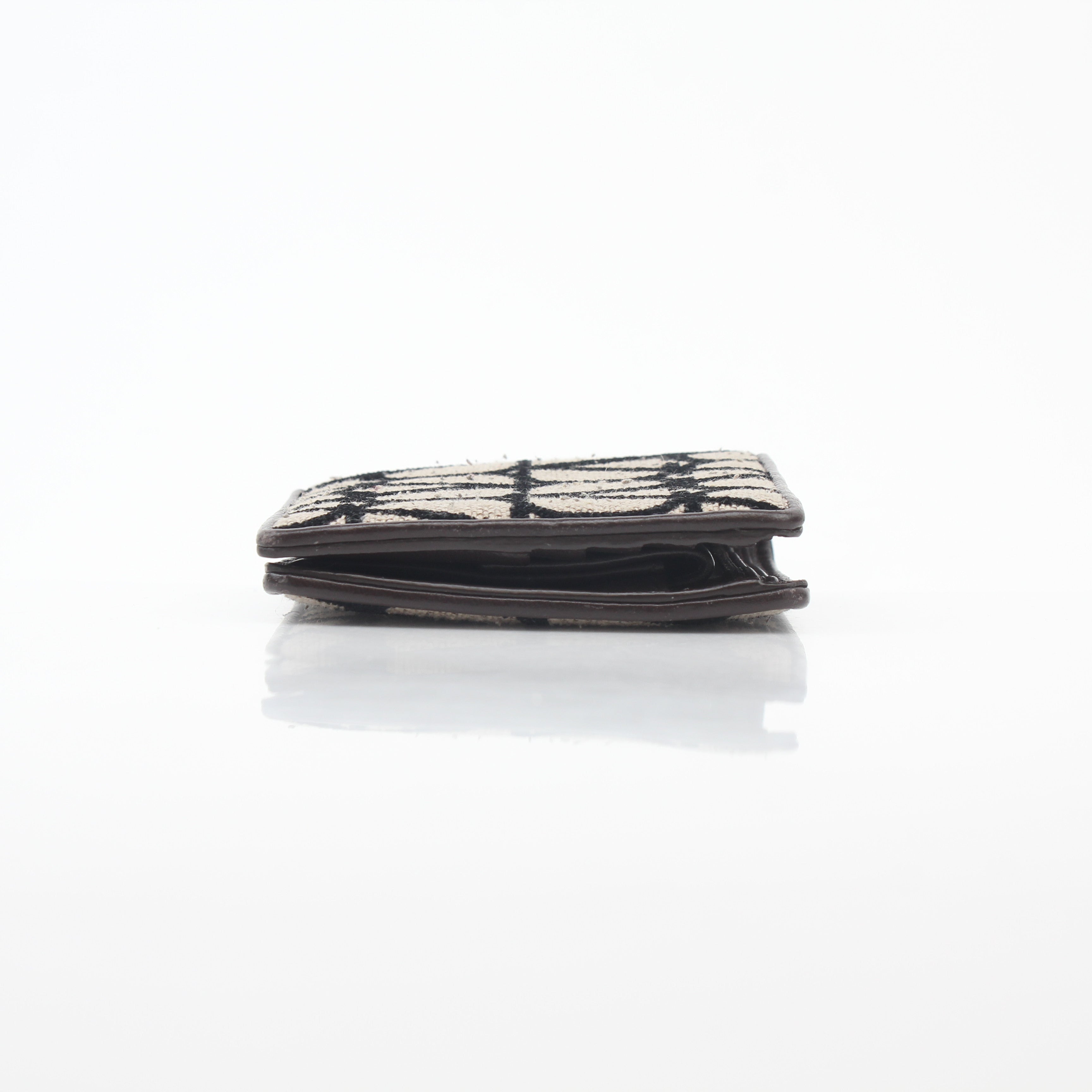 Valentino Garavani Toile Iconographe bifold wallet in natural and black leather, featuring signature design and branding details.