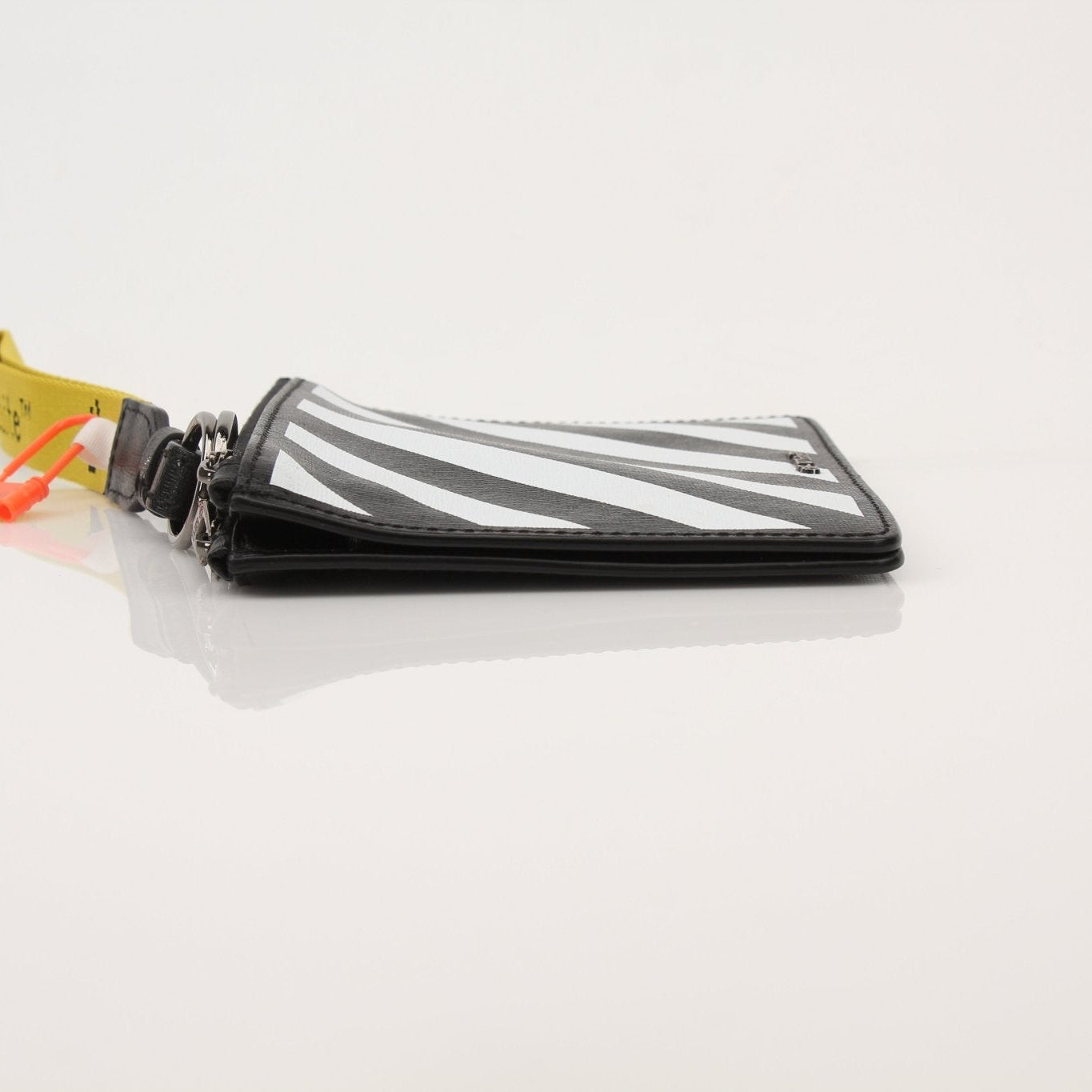 Gold & Beyond Off-White Diagonal Clutch handbag with geometric design and zip closure, stylish accessory for evening or casual use.