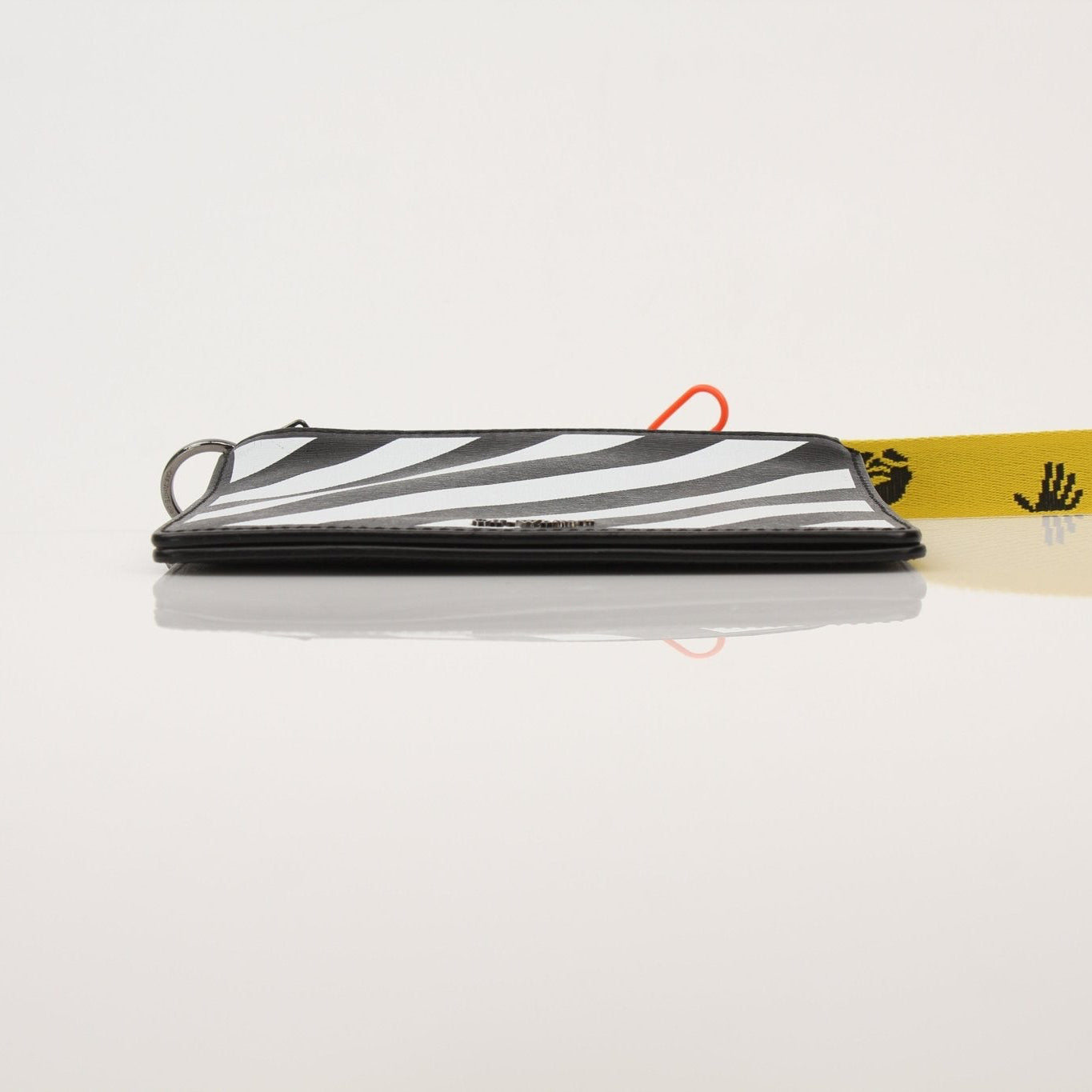 Gold & Beyond Off-White Diagonal Clutch handbag with signature diagonal stripe design and compact, stylish appearance.