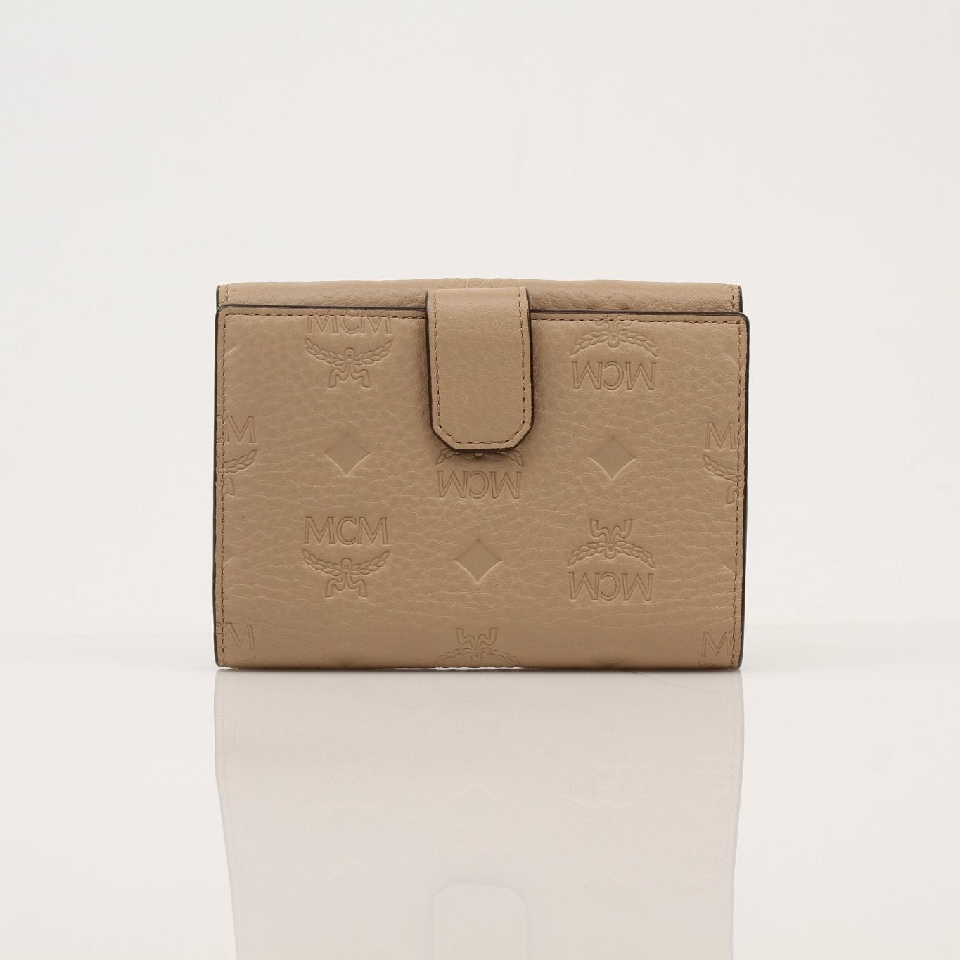 Gold & Beyond MCM trifold beige wallet showing multiple card slots and sleek leather design.