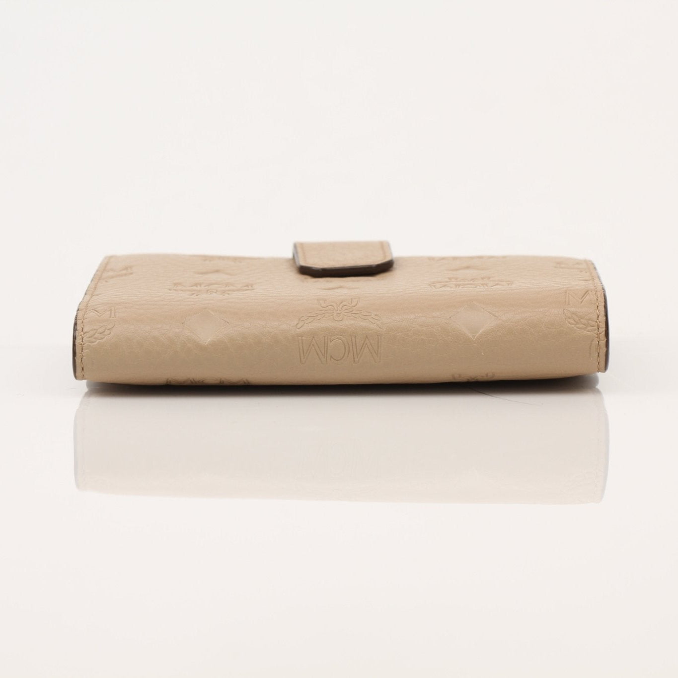 Gold & Beyond MCM trifold beige wallet with multiple card slots and a sleek, compact design.