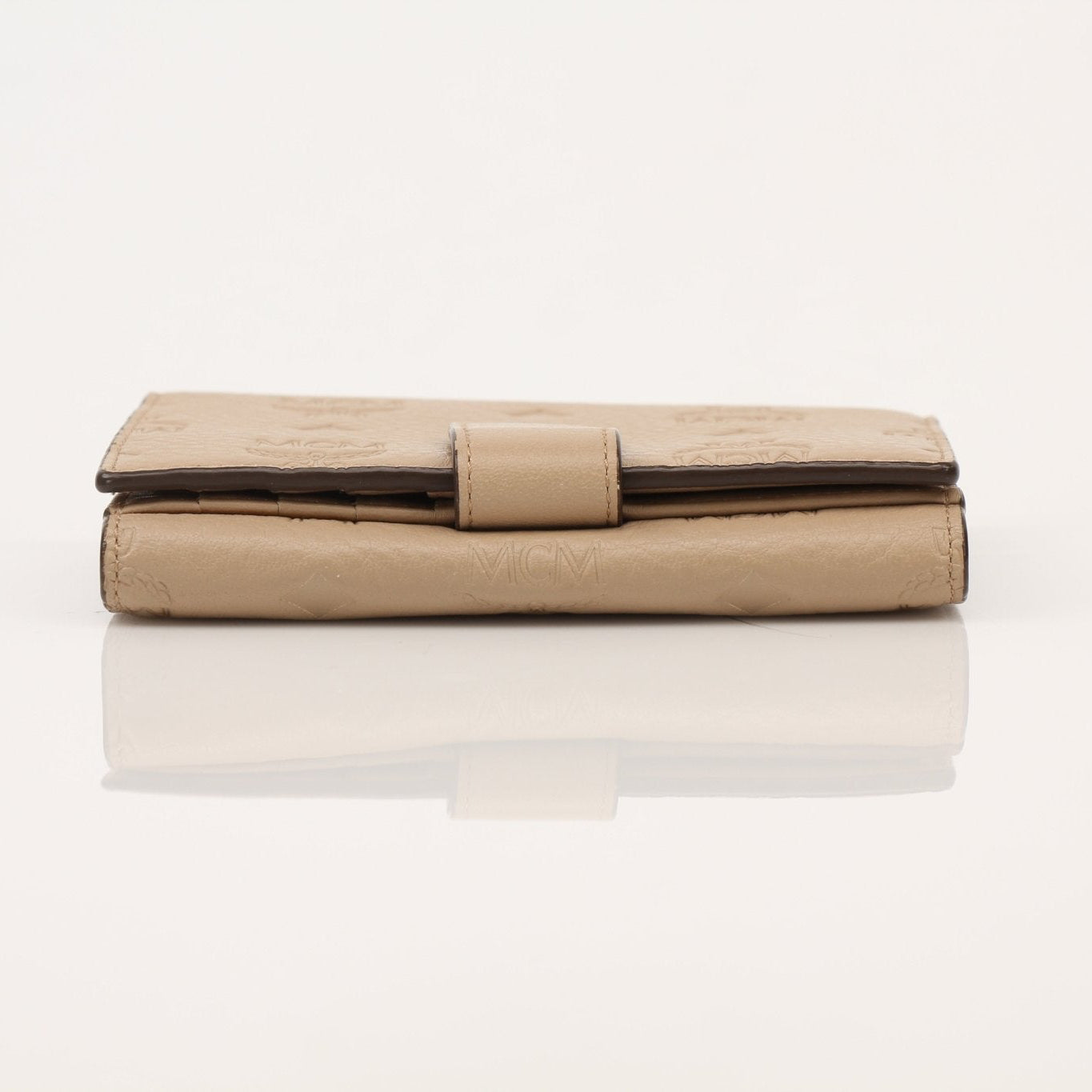 Gold & Beyond MCM trifold beige wallet with multiple card slots and a sleek design.
