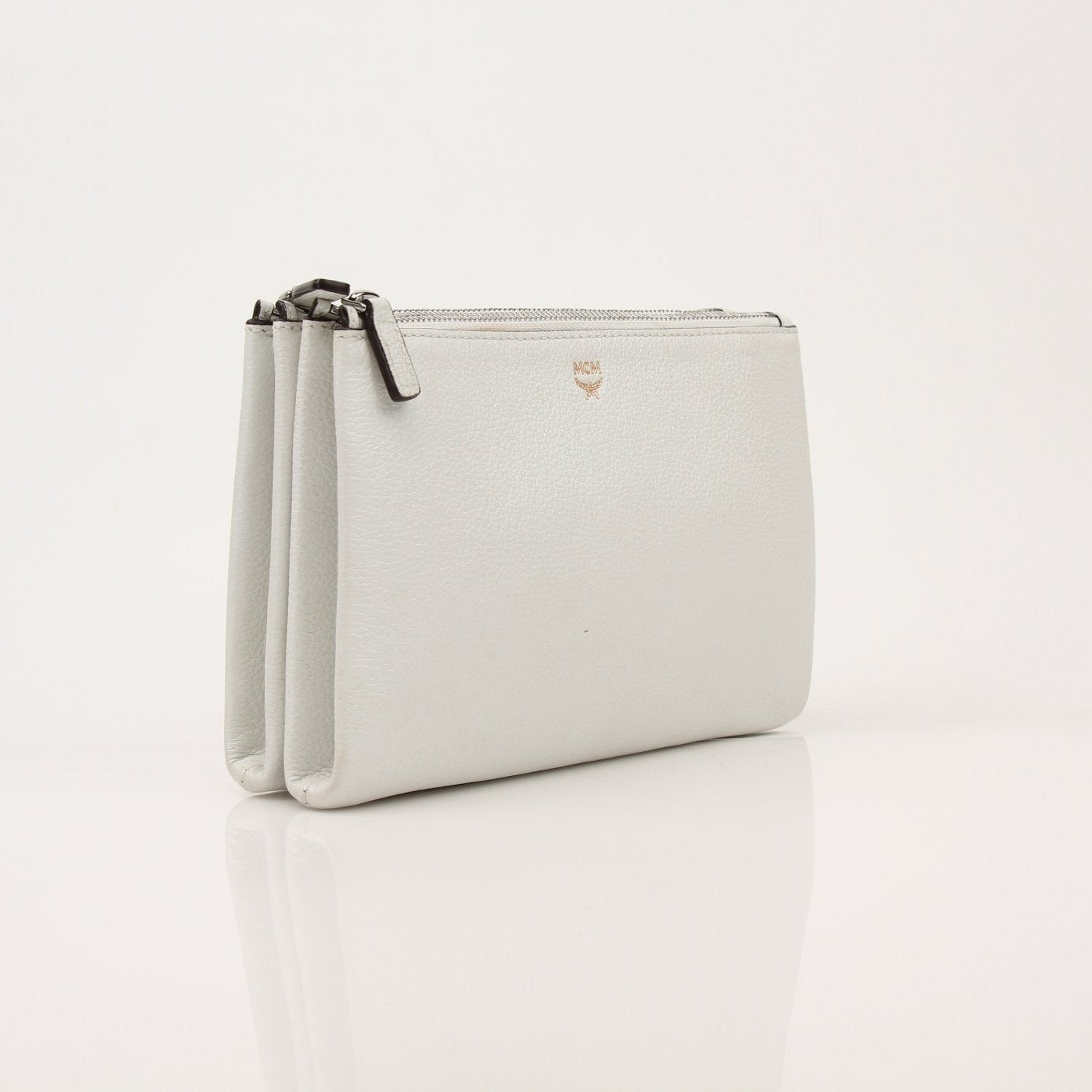 Gold & Beyond MCM double pocket crossbody handbag with stylish design and adjustable strap, perfect for everyday use.