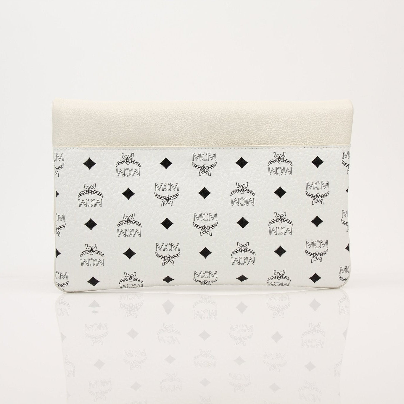 Gold & Beyond MCM fold-over crossbody handbag with adjustable strap and sleek design, shown in black leather.