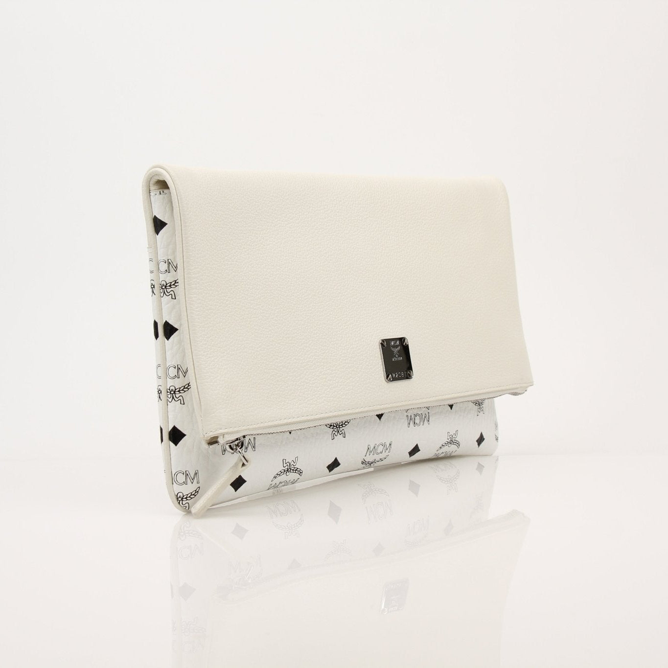 Gold & Beyond MCM fold-over crossbody pouch handbag with sleek design and gold hardware, shown with adjustable strap and compact shape.