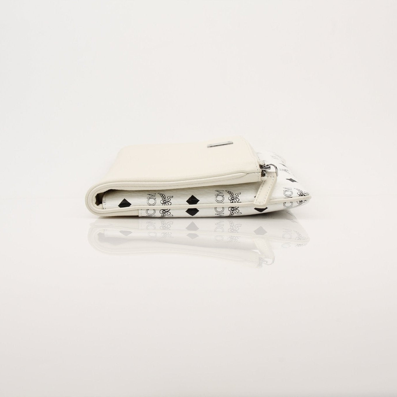 Gold & Beyond MCM fold-over crossbody pouch handbag with sleek design and adjustable strap, shown on a white background.