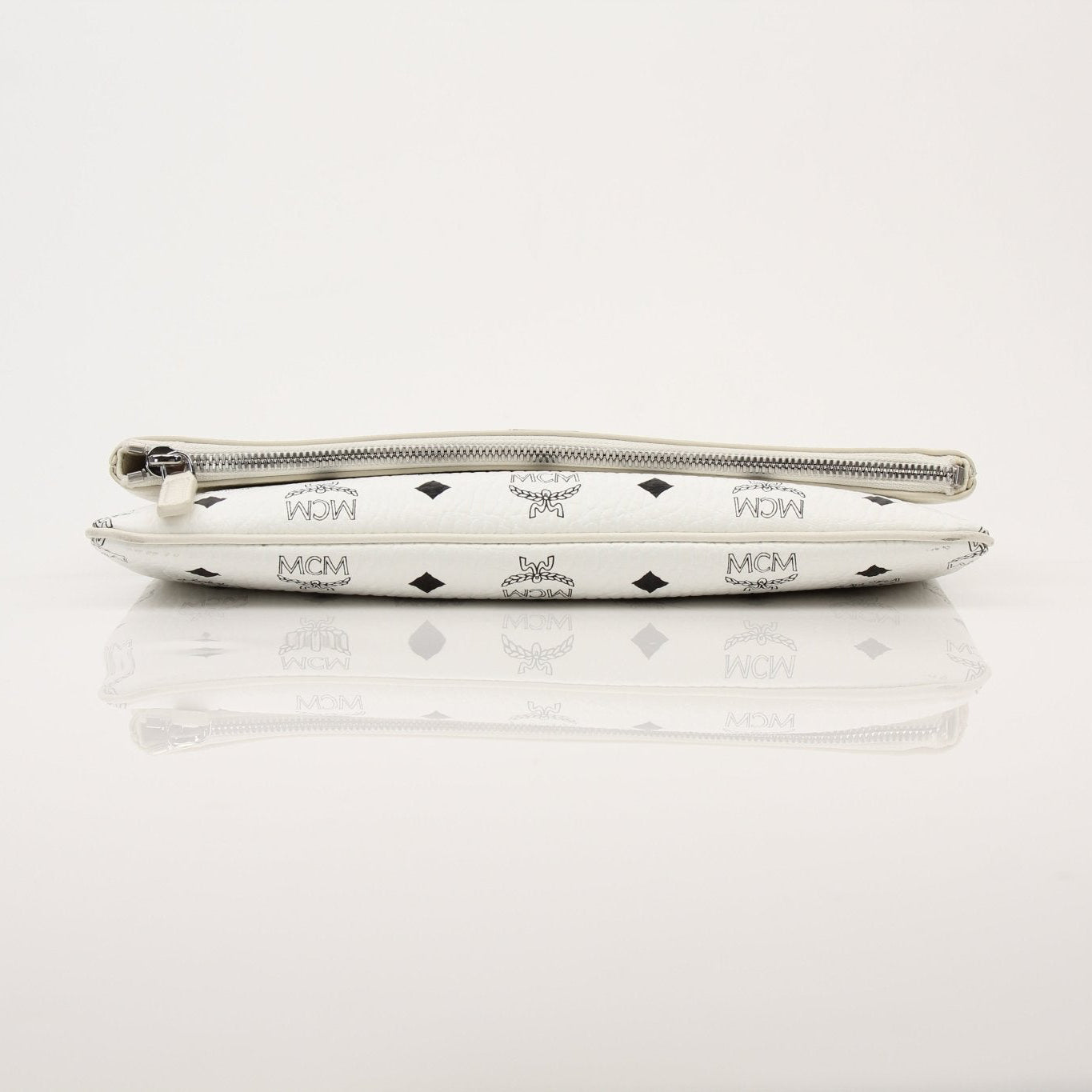 Gold & Beyond MCM fold-over crossbody pouch handbag with sleek design and adjustable strap on white background.