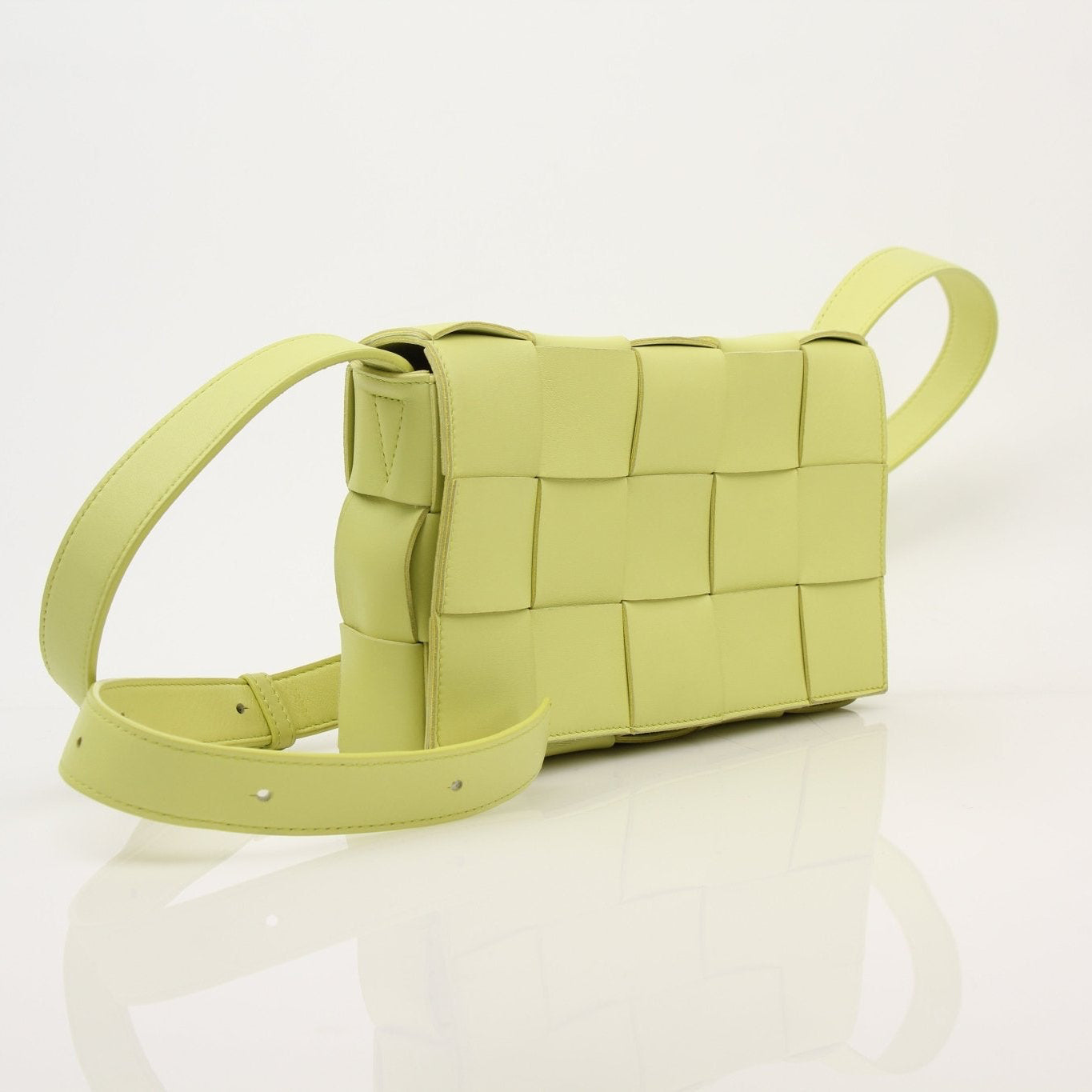 Bottega Veneta Kiwi Cassette Crossbody Bag in green leather, handbag style with adjustable strap and signature design.