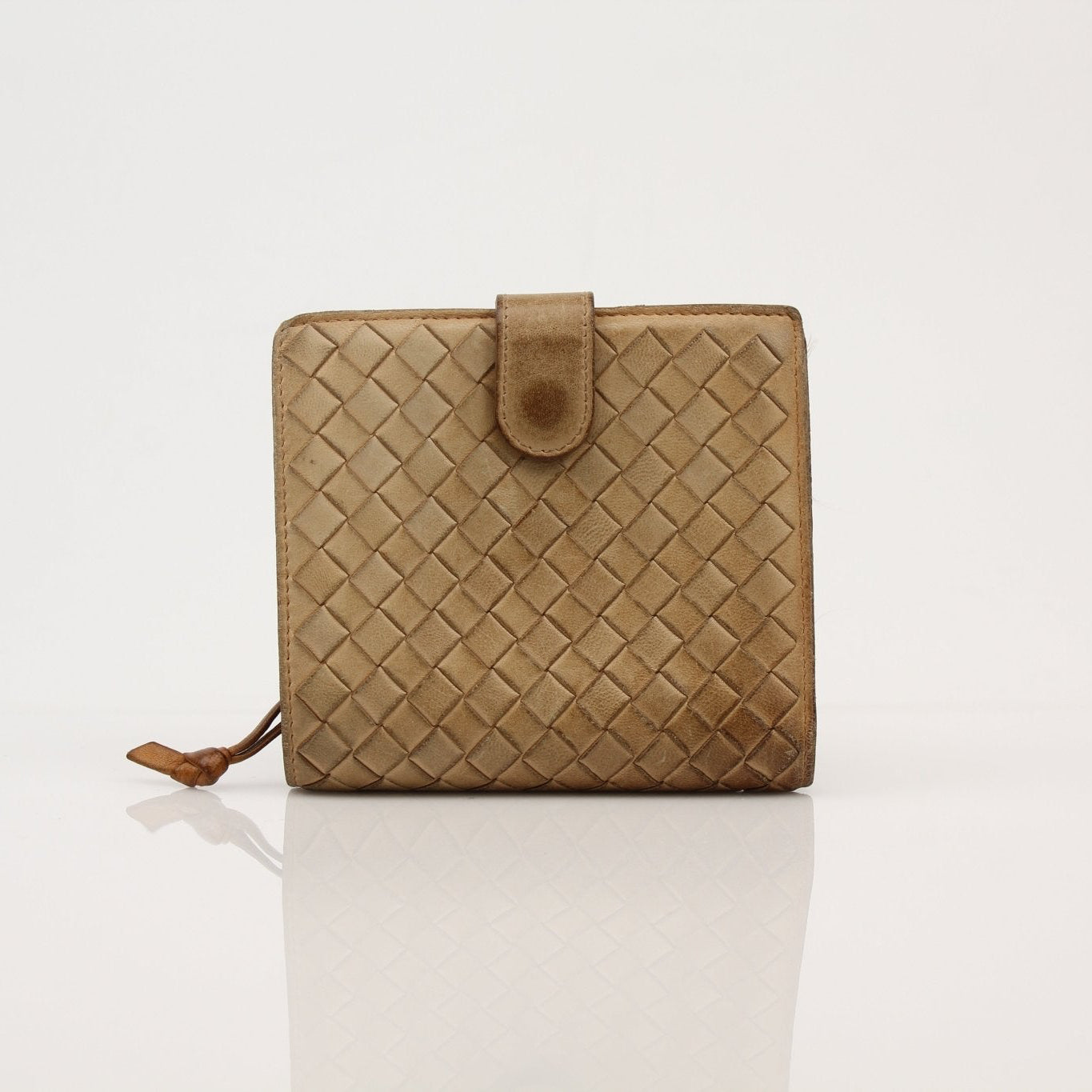 Vintage Bottega Veneta Intrecciato leather wallet with gold accents, shown open with card slots and classic woven design.