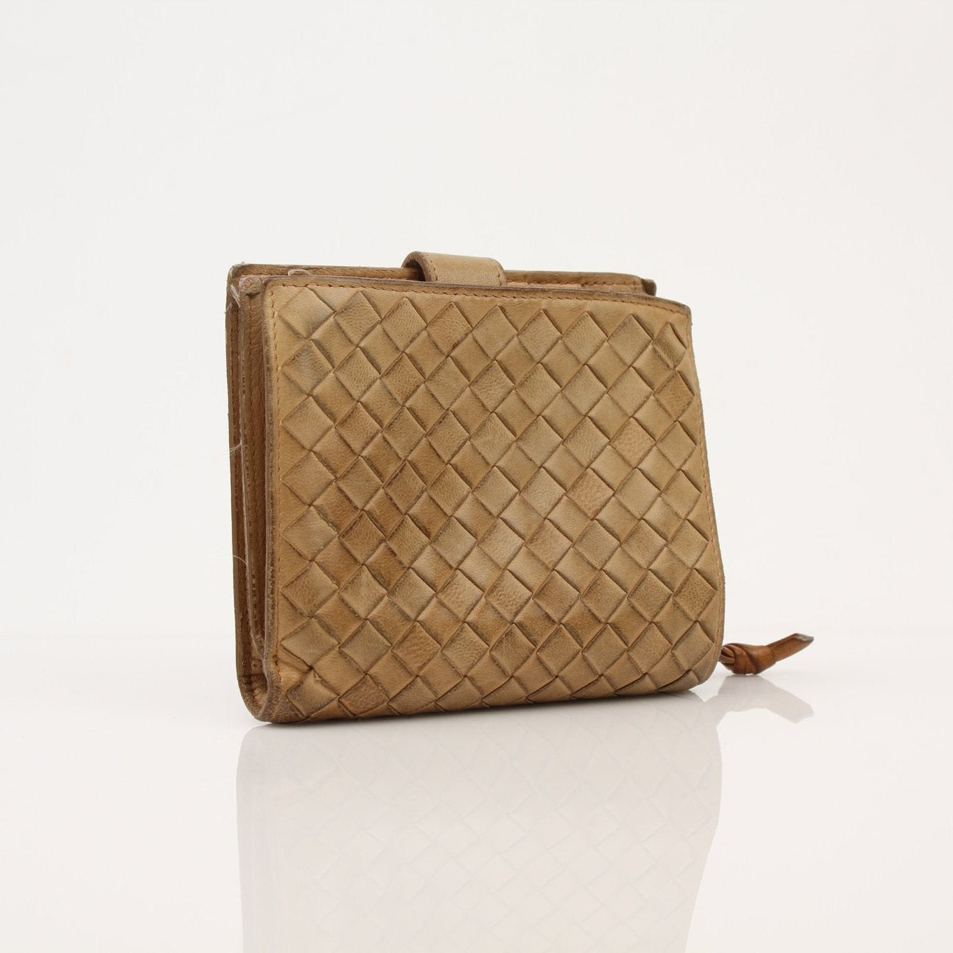Gold & Beyond Bottega Veneta vintage Intrecciato wallet showing woven leather exterior and classic design.