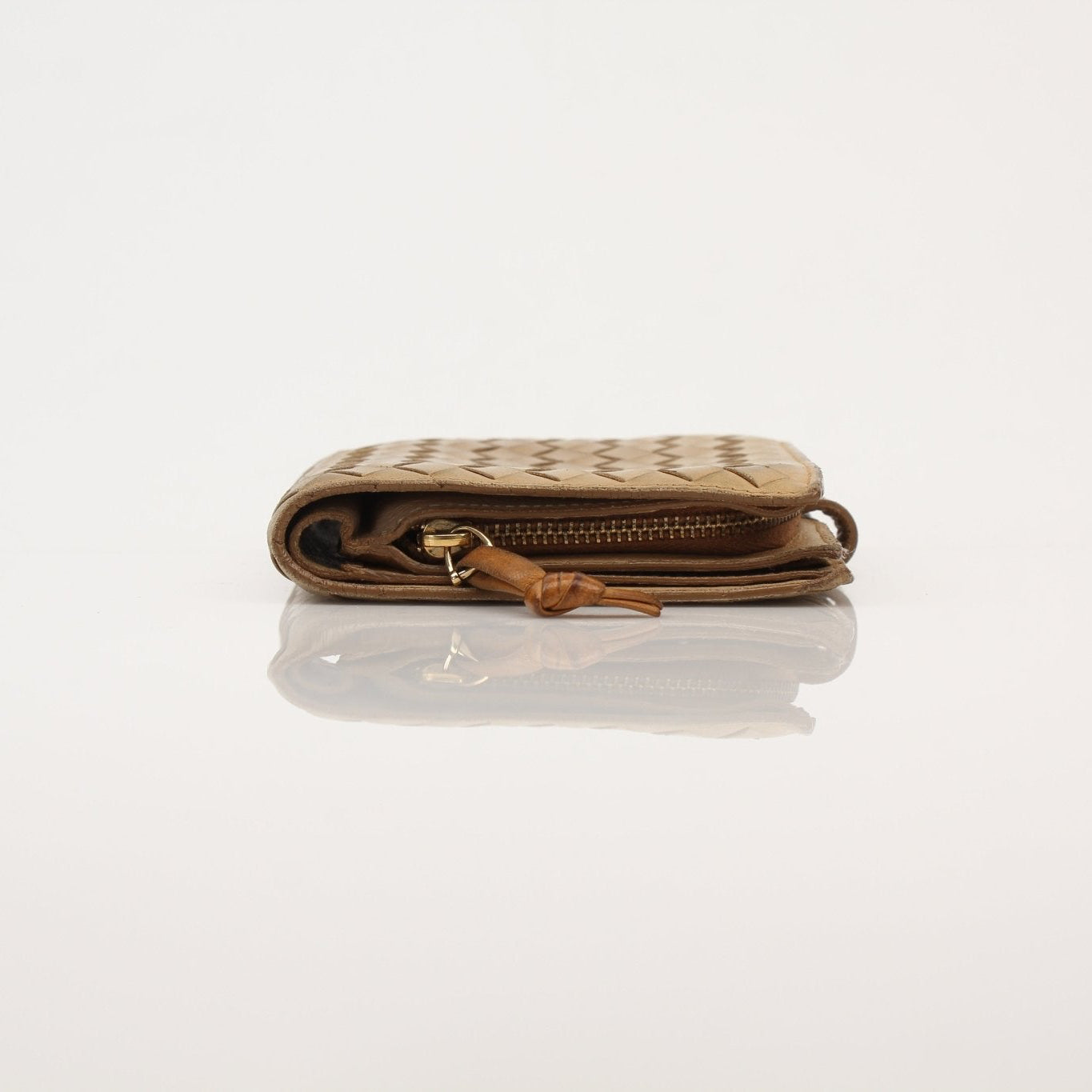 Vintage Bottega Veneta Intrecciato leather wallet in classic woven design, showcased by Gold & Beyond.