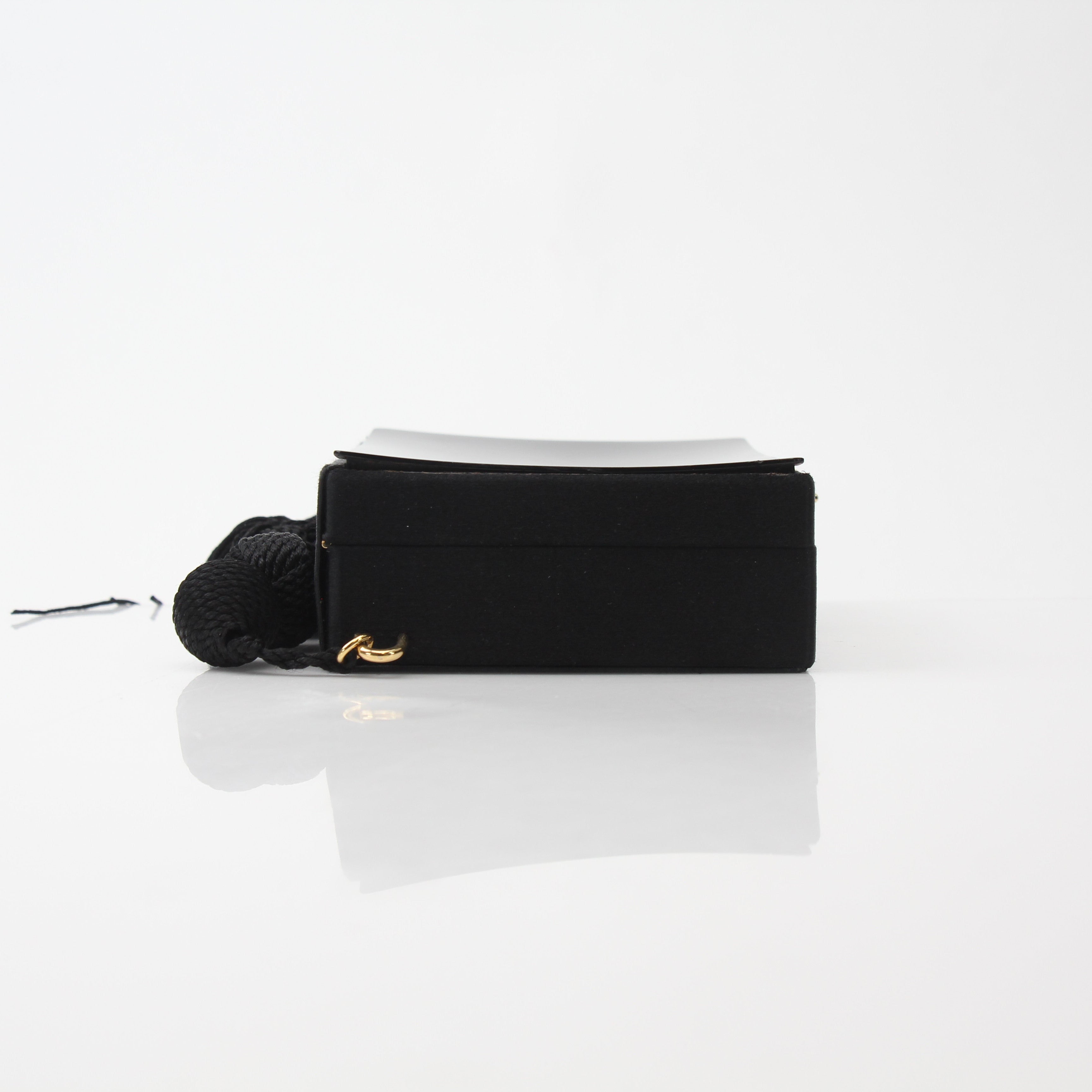 Chanel Interlocking CC Clutch Bag with Tassel Detail