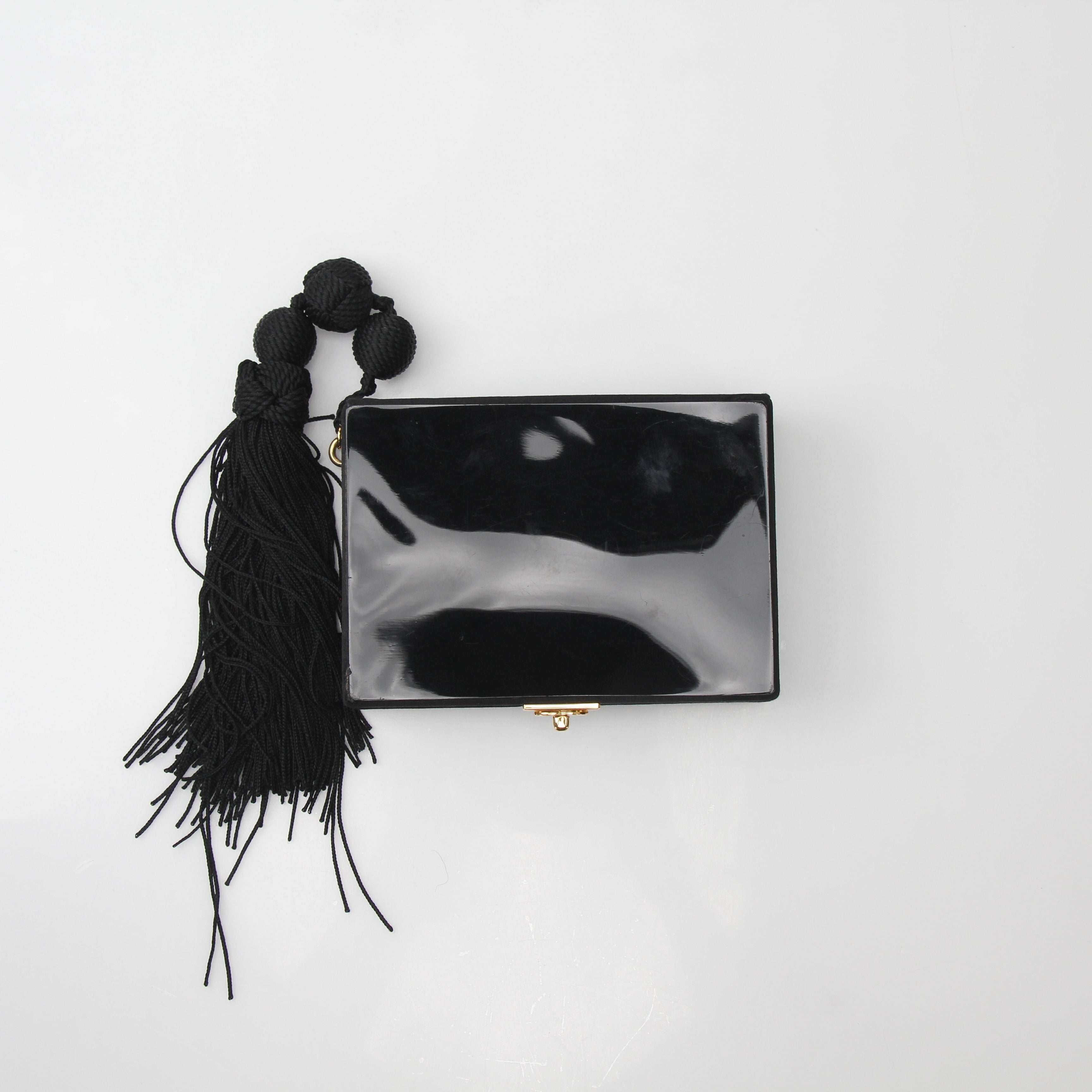 Chanel Interlocking CC Clutch Bag with Tassel Detail