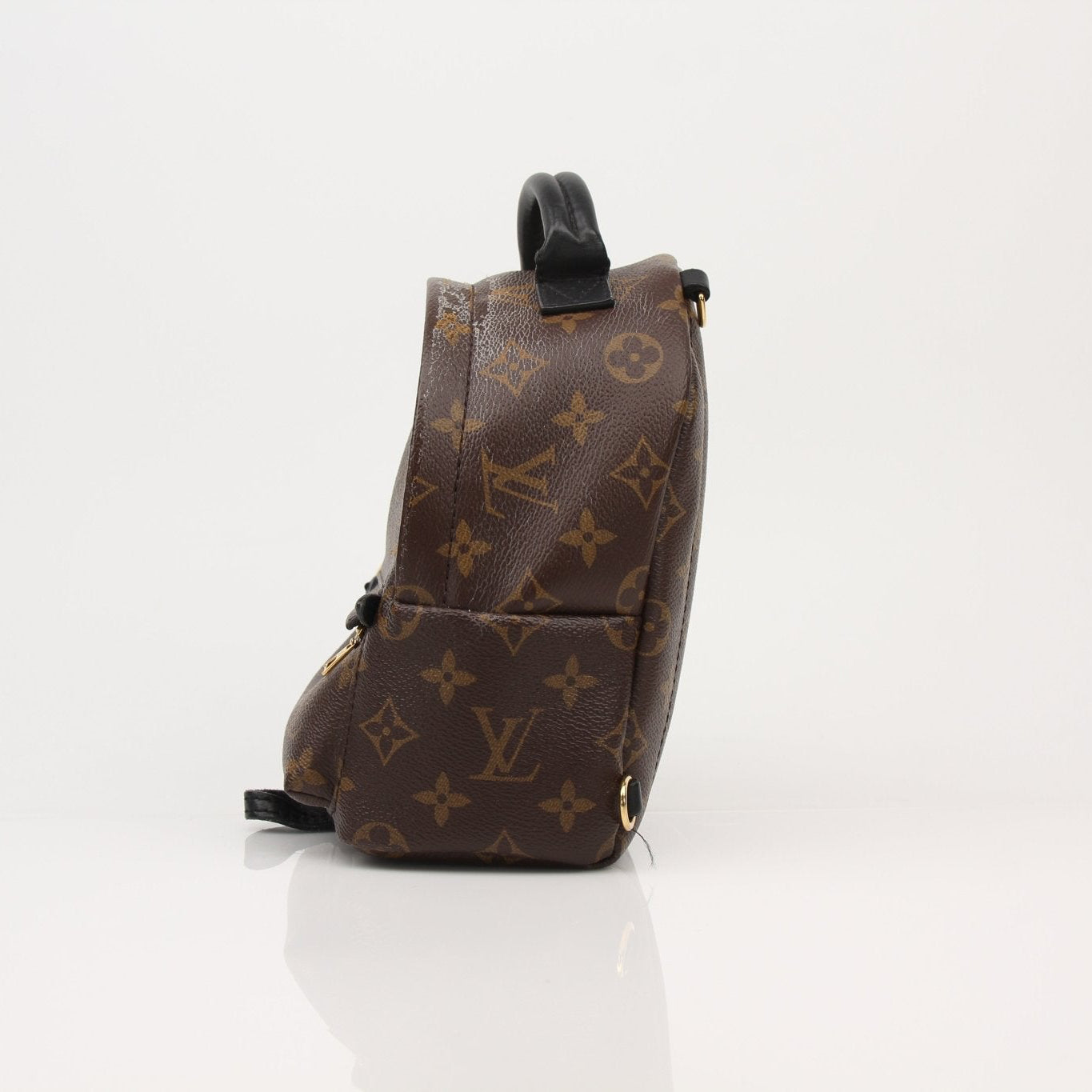 Gold & Beyond Louis Vuitton Palm Springs Mini Backpack handbag with beige and brown monogram fabric and leather straps.