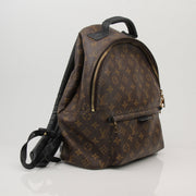 Louis Vuitton Palm Springs MM backpack in monogram canvas, stylish travel bag with adjustable straps and spacious interior.