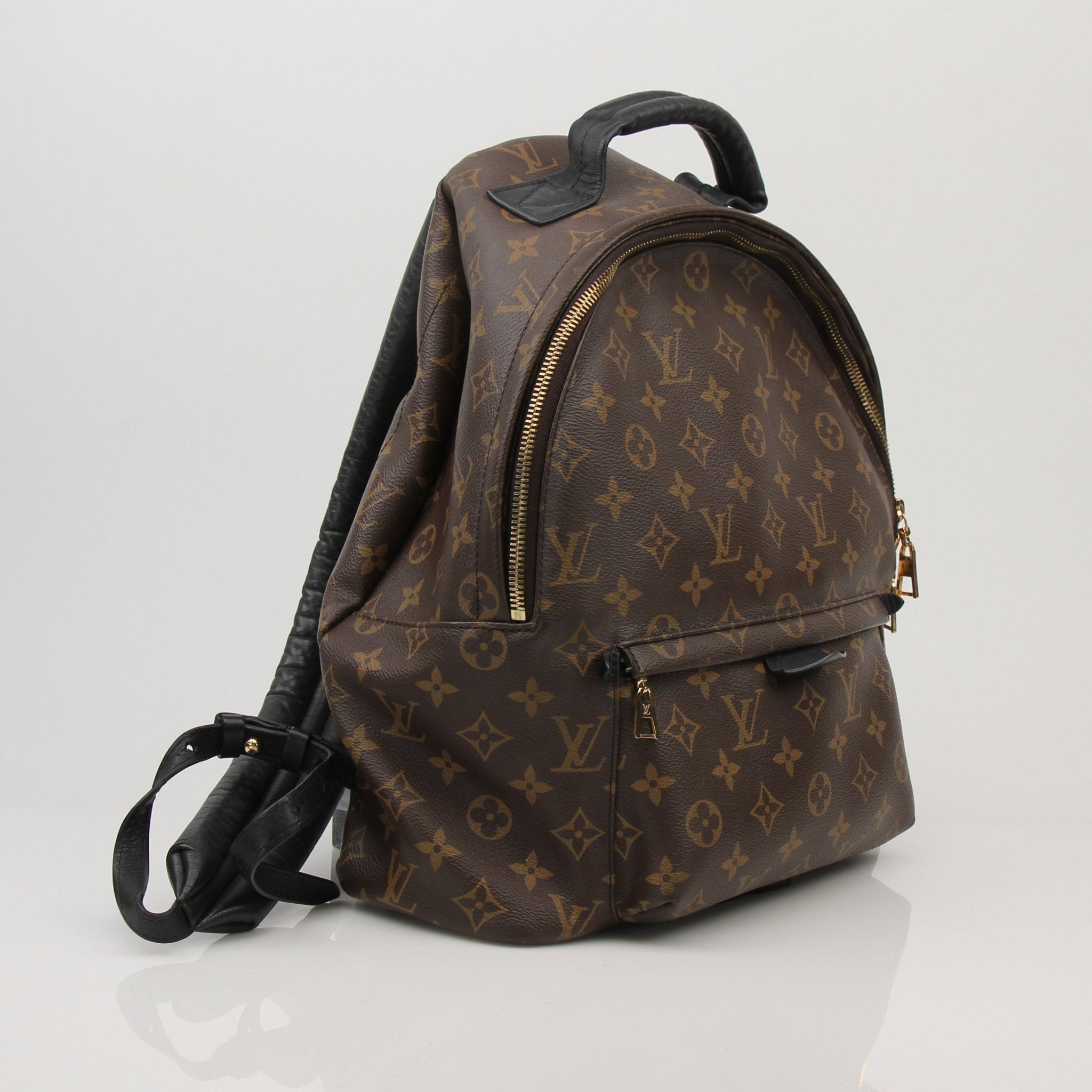 Louis Vuitton Palm Springs MM backpack in monogram canvas, stylish travel bag with adjustable straps and spacious interior.