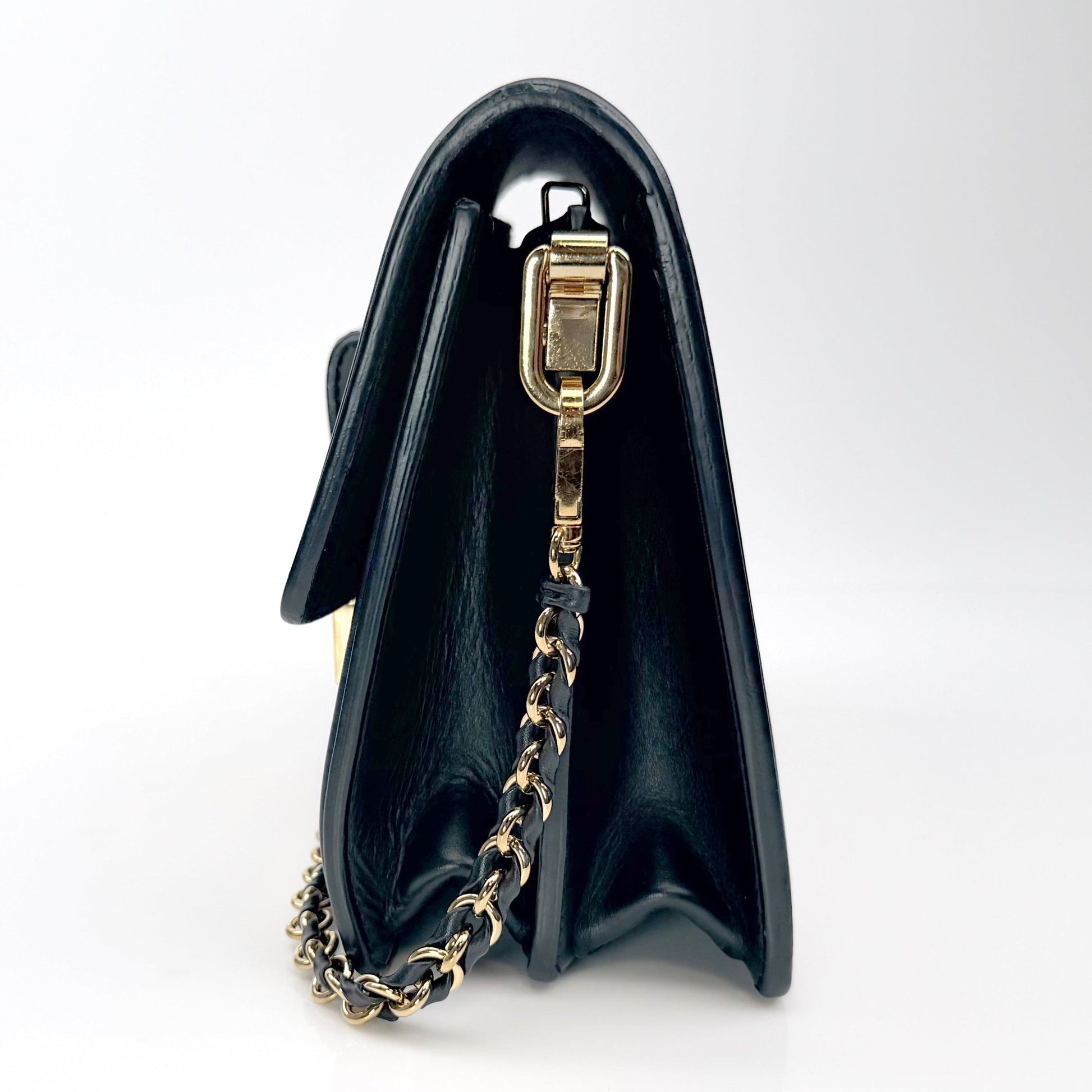 Gold & Beyond Louis Vuitton Mini Dauphine crossbody handbag with gold hardware, featuring signature monogram pattern and adjustable strap.