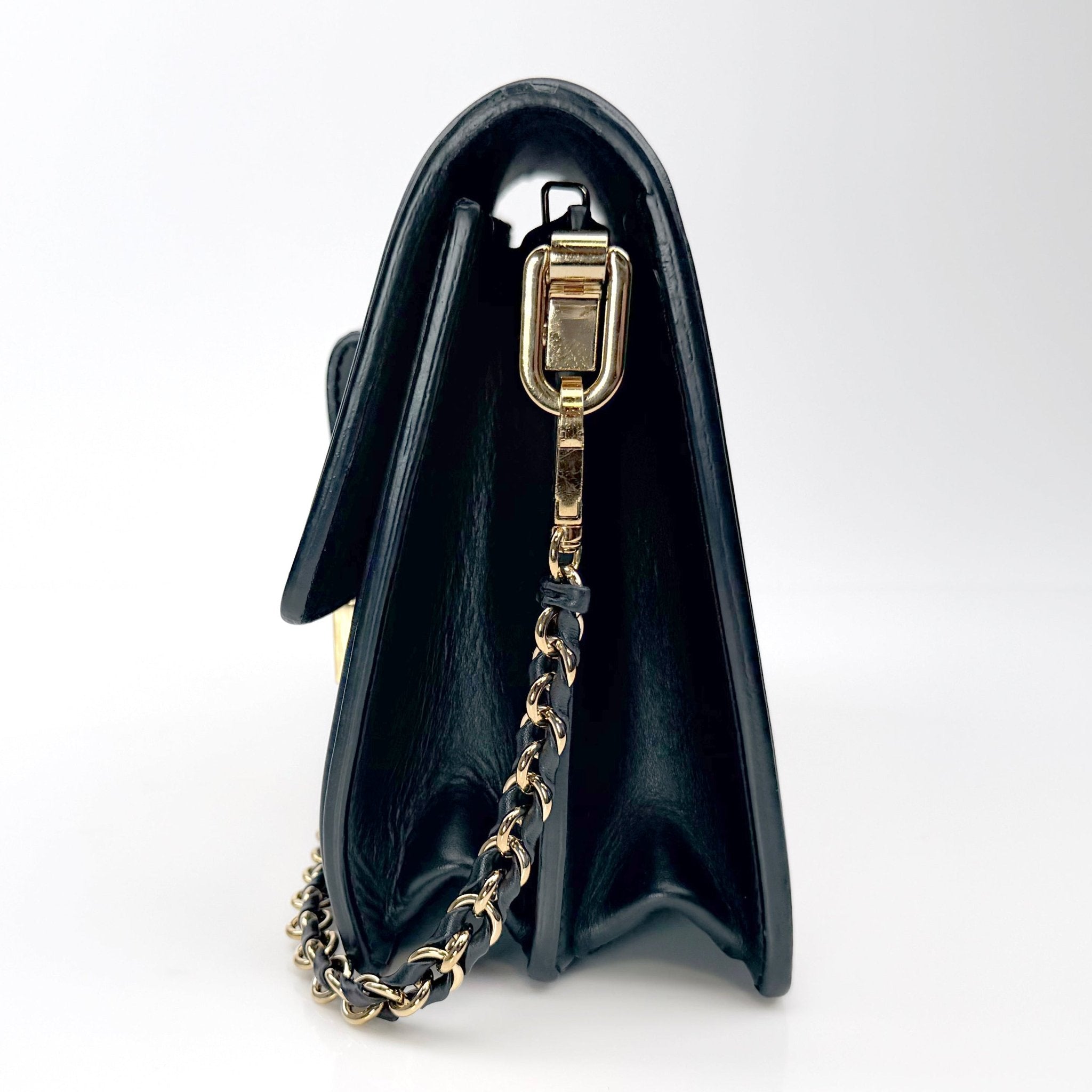 Gold & Beyond Louis Vuitton Mini Dauphine crossbody handbag with gold hardware, featuring signature monogram pattern and adjustable strap.