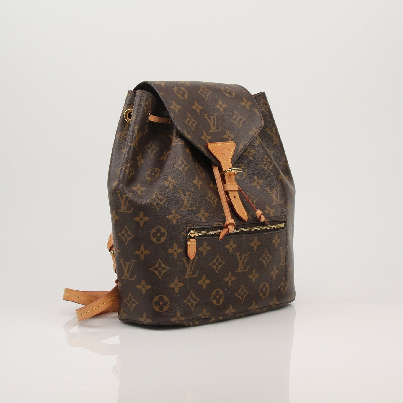 Gold & Beyond Louis Vuitton Montsouris backpack, a stylish travel bag with signature monogram pattern and leather accents.