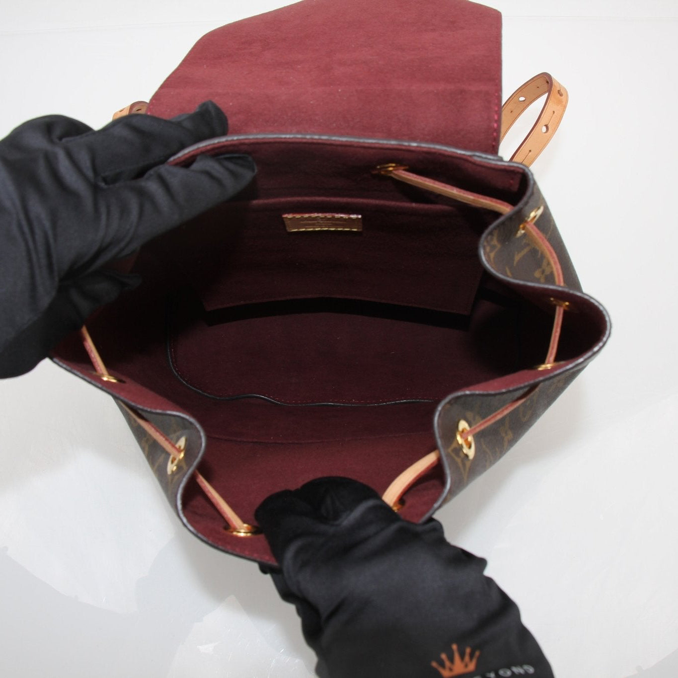 Gold & Beyond Louis Vuitton Montsouris Backpack, stylish travel bag with monogram canvas, leather accents, and adjustable straps.
