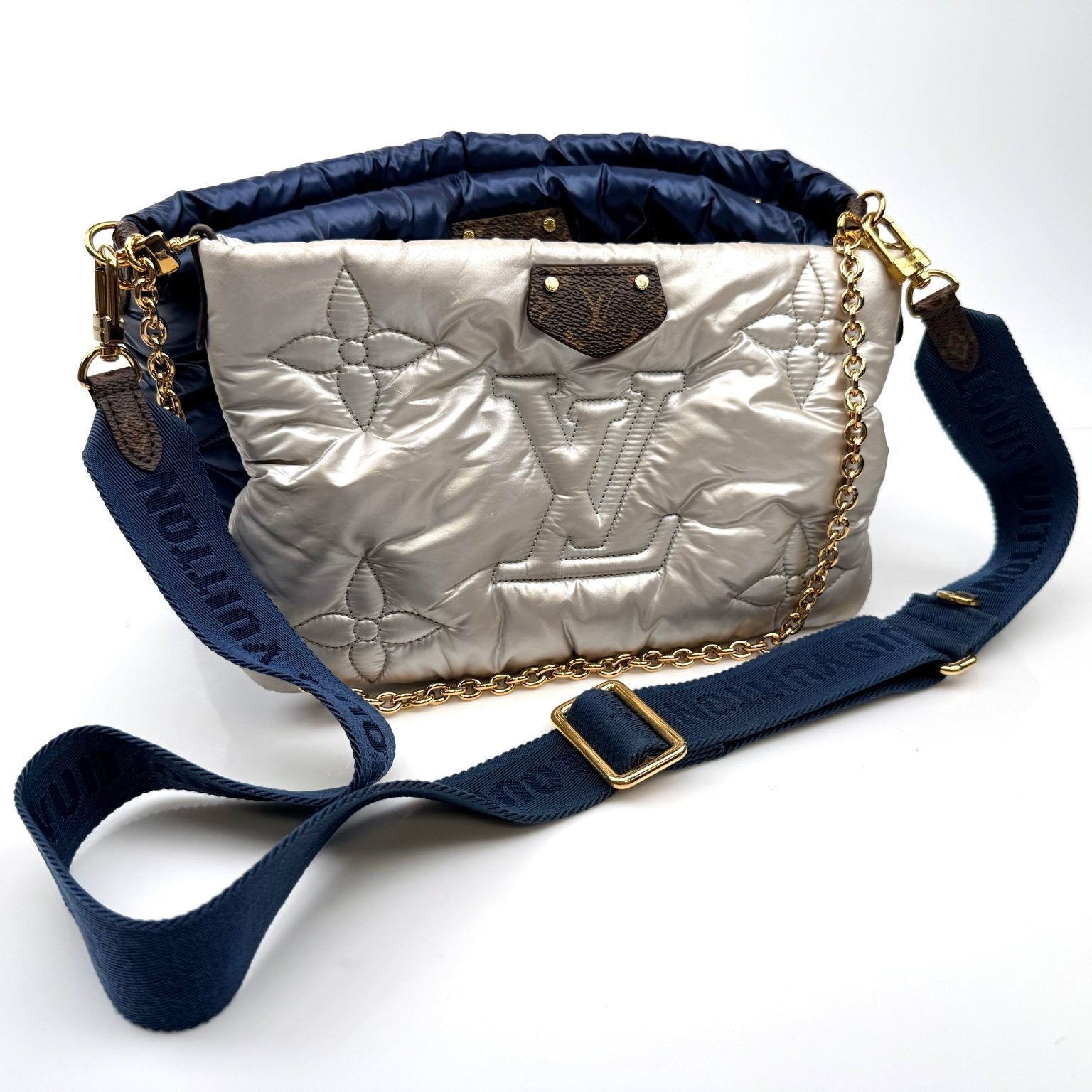 Louis Vuitton Pillow Multi Pochette handbag with gold accents and adjustable straps, showcasing its stylish design and compact size.