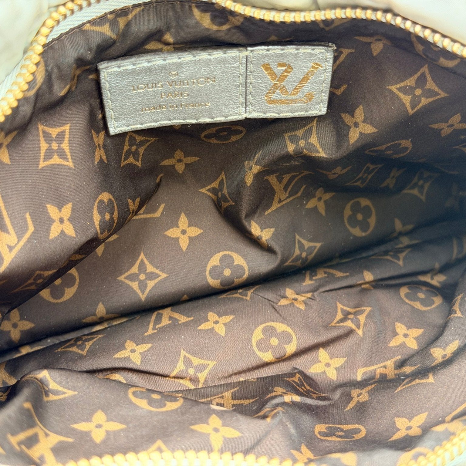Louis Vuitton Pillow Multi Pochette handbag with padded design and gold accents, showcasing a stylish, versatile accessory.